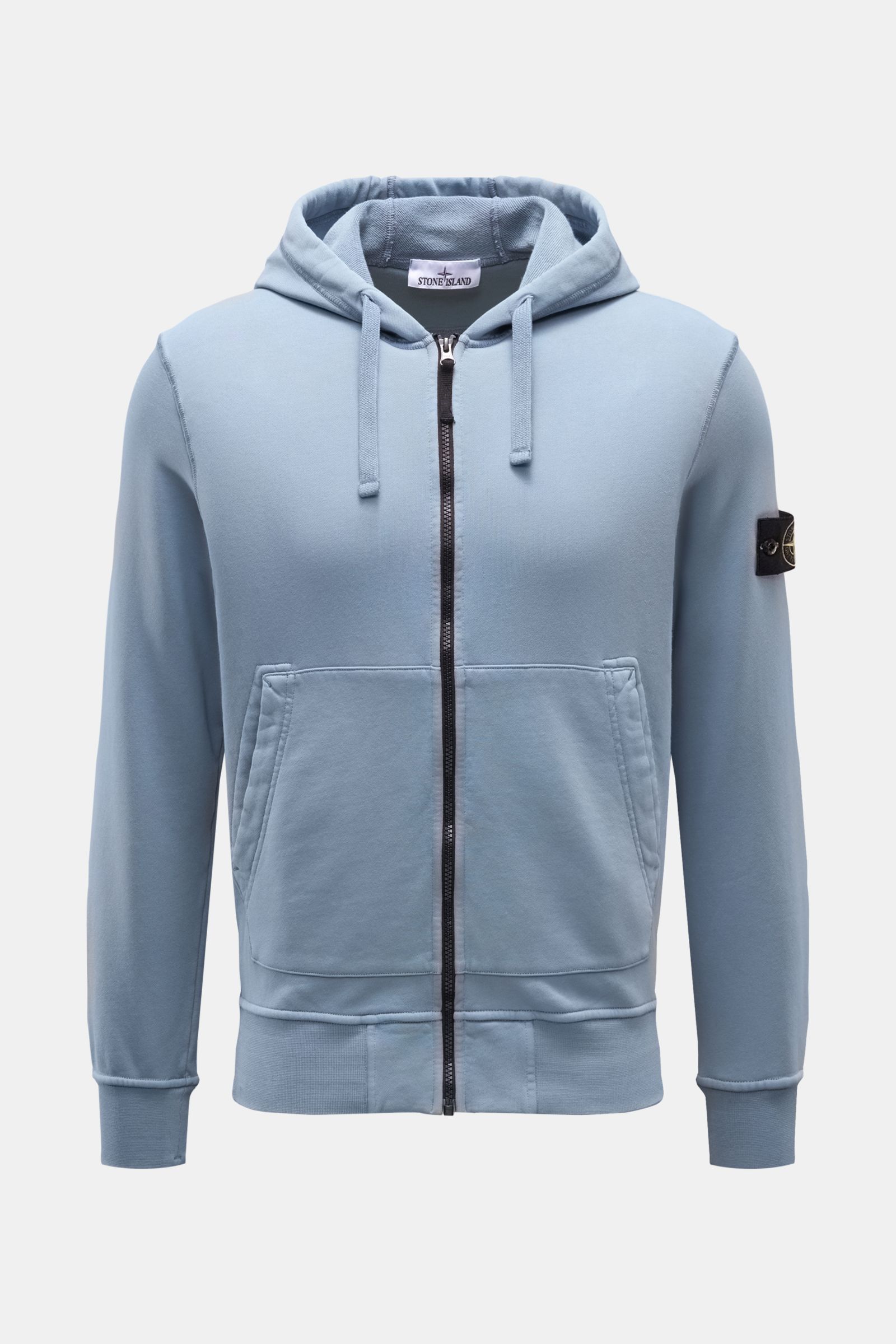 Front view of Stone Island Sweat jacket smoky blue, a slim-fit, piece-dyed cotton zip-up with hood, split kangaroo pocket, and compass badge on sleeve.

A relaxed basic from STONE ISLAND: This piece-dyed sweat jacket with a practical hood made of pure 