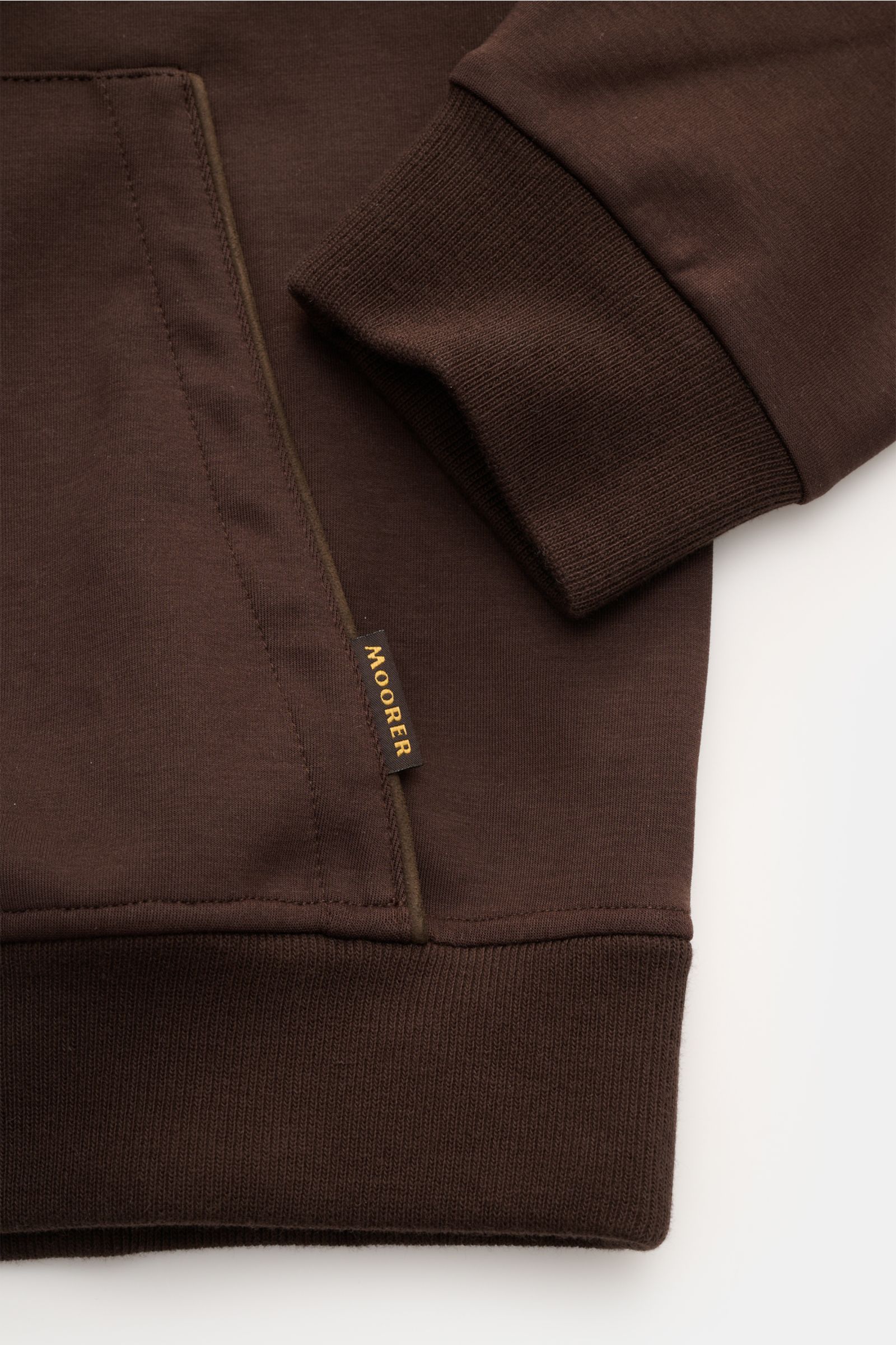 Close-up front view of Moorer Sweat jacket 'Matthew Felpa' dark brown showing soft double-sided knit, ribbed cuffs, and kangaroo pocket with leather jetted trim. Sporty luxury: This sweat jacket by MOORER in a double-sided knit is exceptionally soft with 
