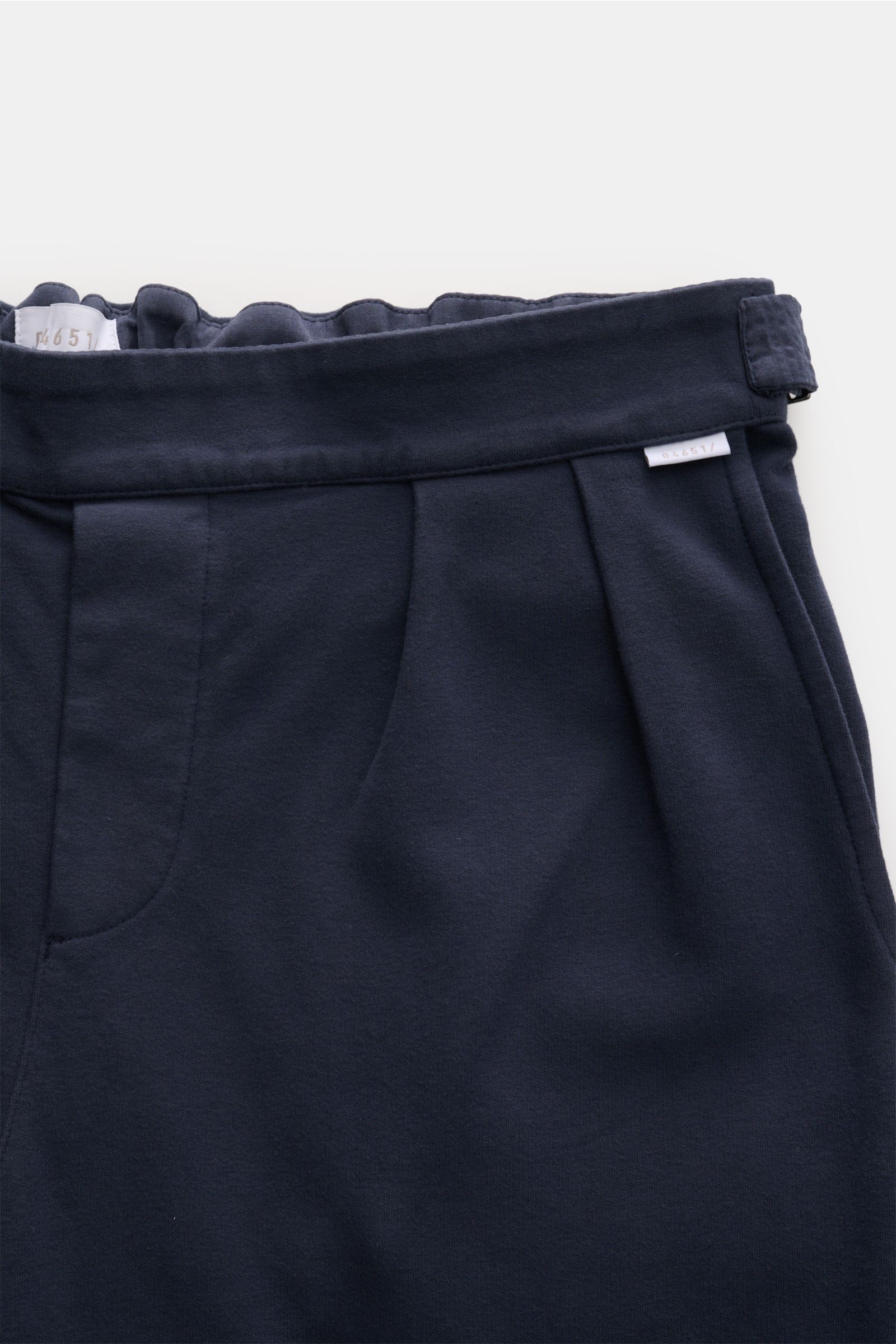 Close-up front view of 04651/ A trip in a bag Cotton trousers navy showing double pleats, side adjusters, and soft cotton jersey fabric.

Description: Enjoy maximum comfort in your everyday life: These comfortable trousers from 04651/ A TRIP IN A BAG a