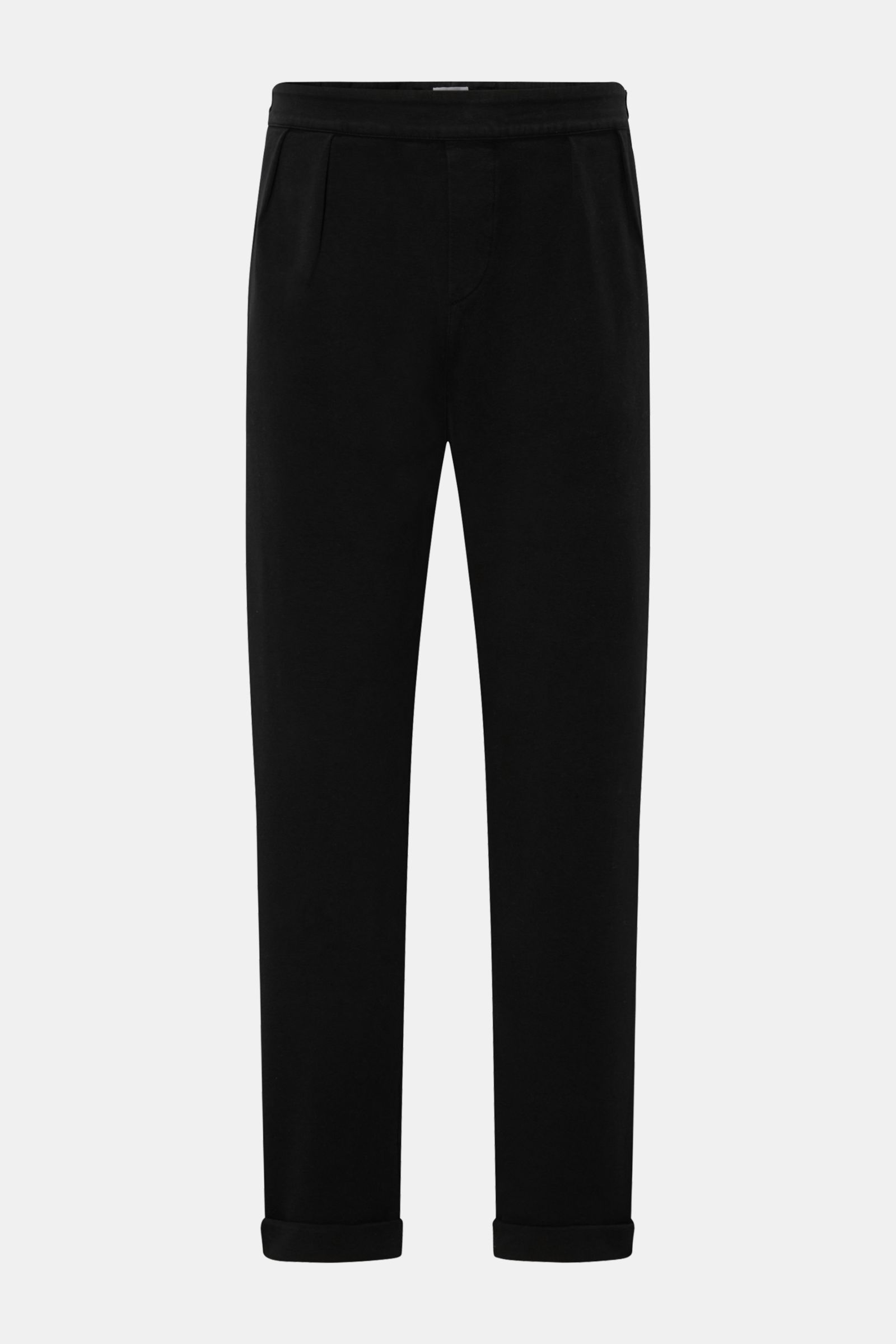 Front view of 04651/ A trip in a bag Cotton trousers black made of soft cotton jersey with double pleats, side adjusters, tapered fit, ankle length, partially elasticated waistband, faux fly, French pockets, hip pockets, and fixed hem turn-up for maximum 