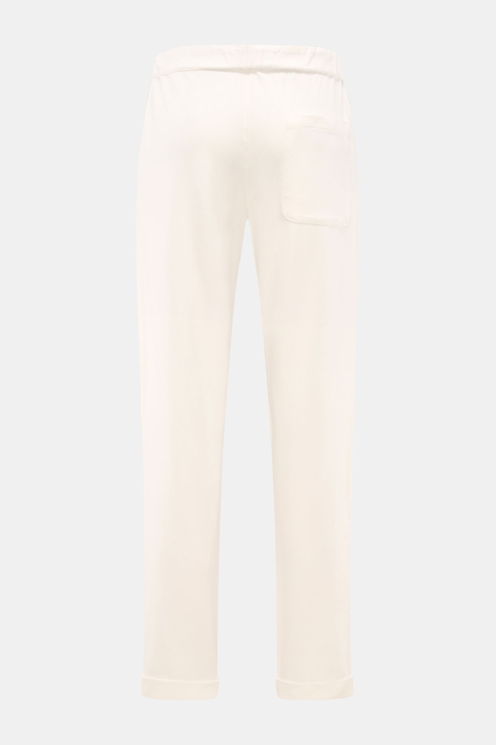 Rear view of 04651/ A trip in a bag Jogger pants 'If' off-white in soft cotton jersey, showing tapered fit, patch back pocket, and fixed hem turn-up. Comfort meets style: These jogger pants in soft cotton jersey by 04651/ A TRIP IN A BAG enhance relaxed l