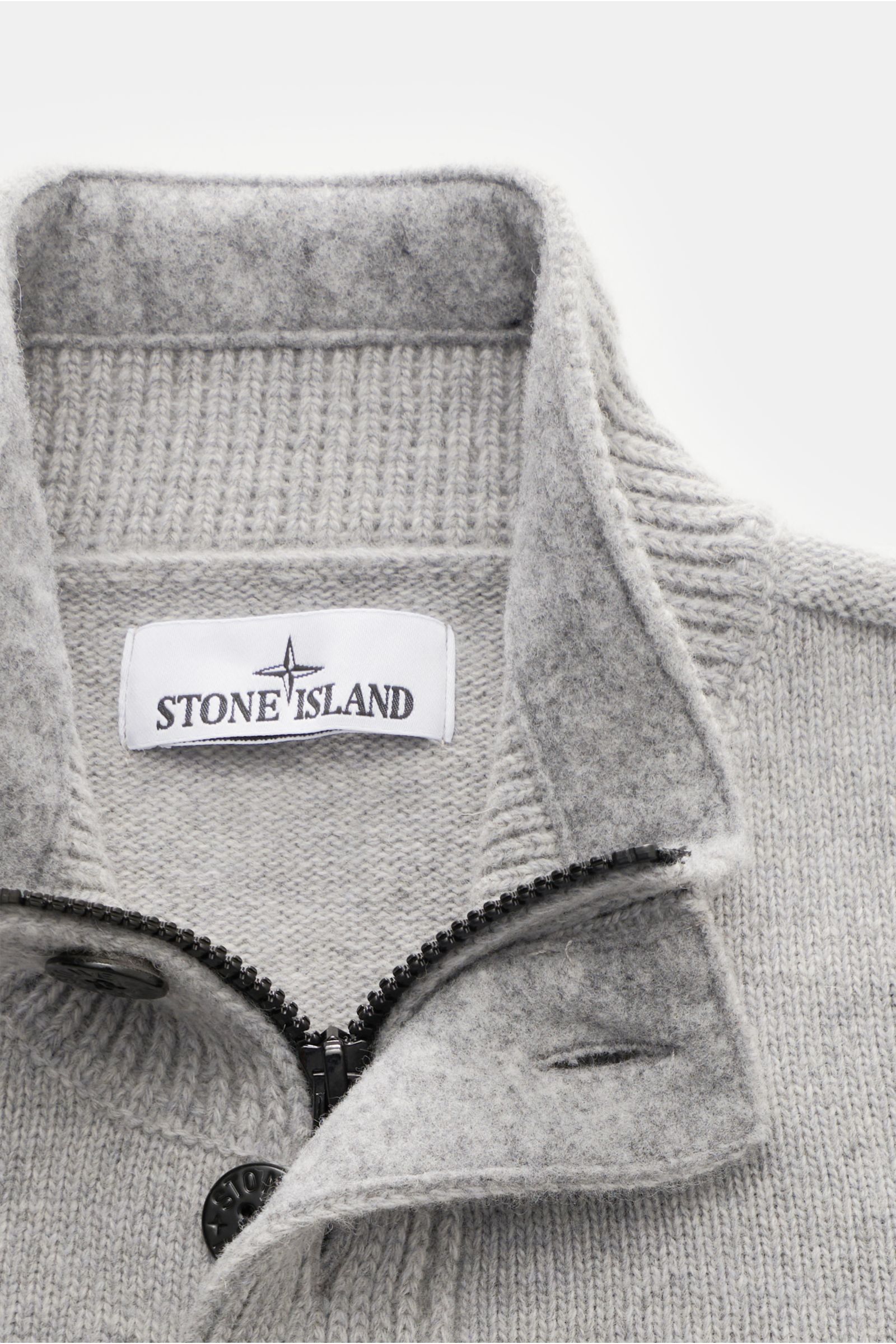 Close-up front view of Stone Island Half-zip jumper 'Lambswool' light grey showing half-zip collar with zip, embossed buttons, and soft wool blend knitwear.

A stylish essential for the colder months: This timeless half-zip jumper by STONE ISLAND with 