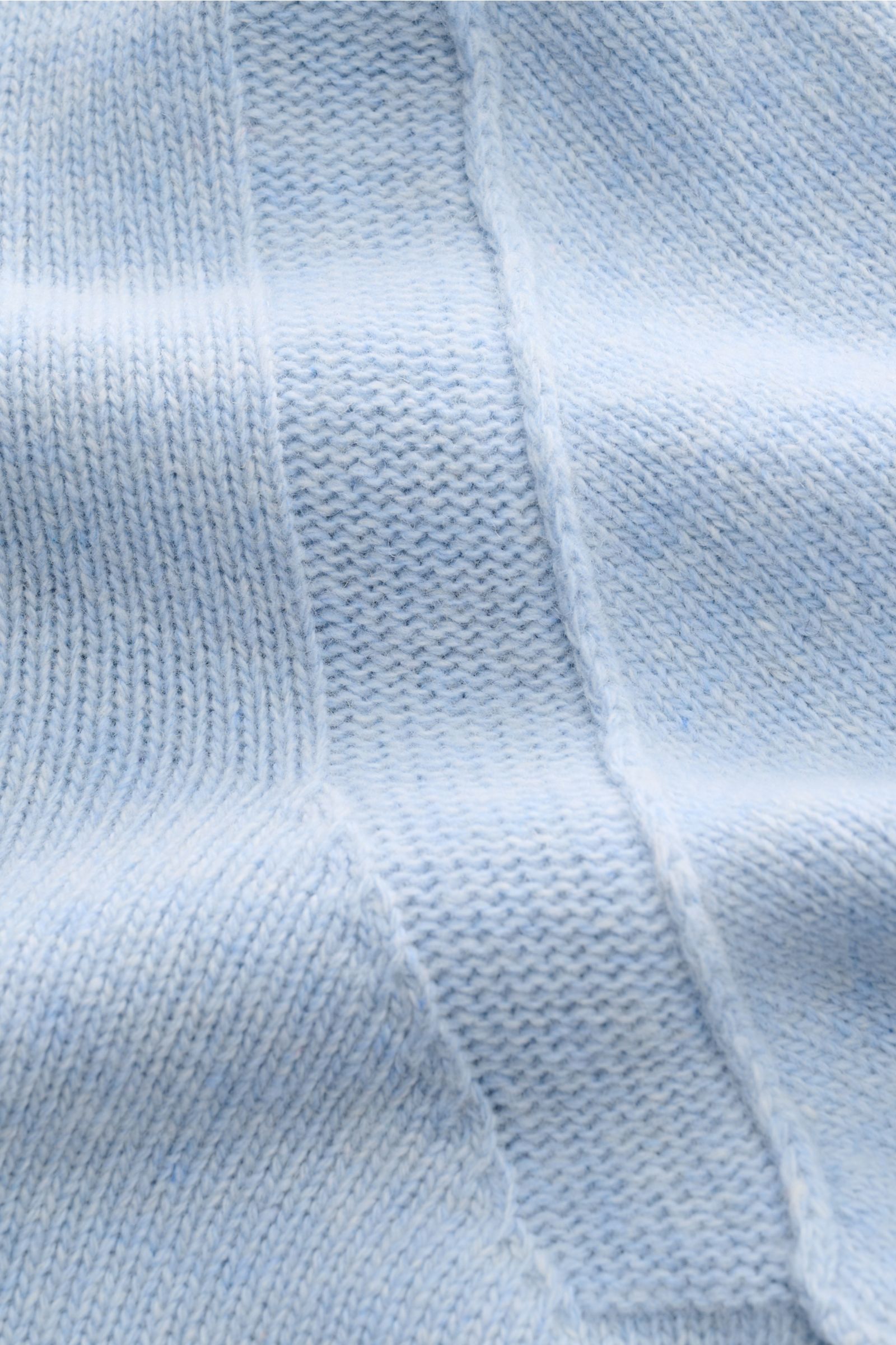 Close-up front view of Stone Island Half-zip jumper 'Lambswool' light blue showing medium-fine knit, soft wool blend fabric, and knit stripes.

Description: A stylish essential for the colder months: This timeless half-zip jumper by STONE ISLAND with z