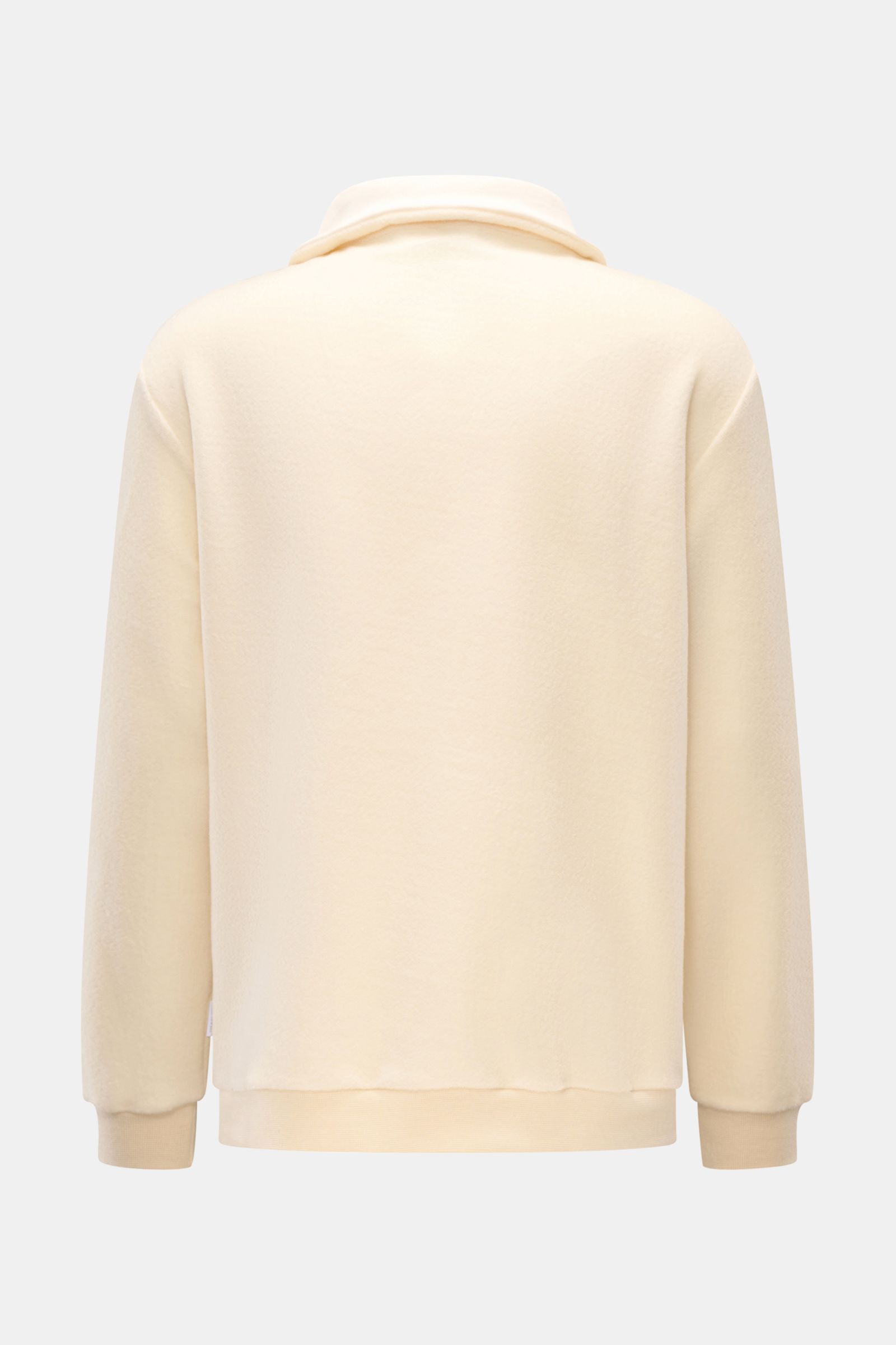 04651/ A trip in a bag Troyer 'Cw Quarter Zip' creme shown from the back, featuring soft fleece texture, wool-cotton blend, regular fit, quarter zip collar, ribbed cuffs, and side seam web label. Lässig durch die Übergangszeit: Der Troyer von 04651/ A TRI