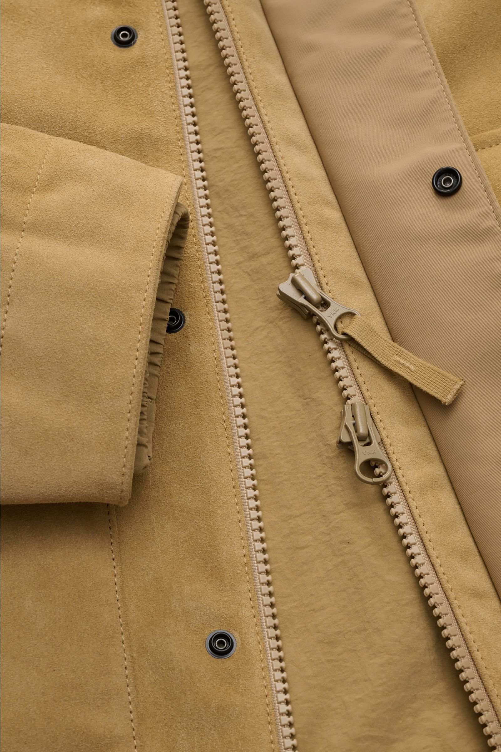Close-up front view of Stone Island Suede jacket 'Ghost Piece' light brown showing split cowhide leather, two-way zip, and snap buttons.

Description: Casual statement piece with authentic leather craftsmanship: The suede jacket 'Split Leather S.I. Gho