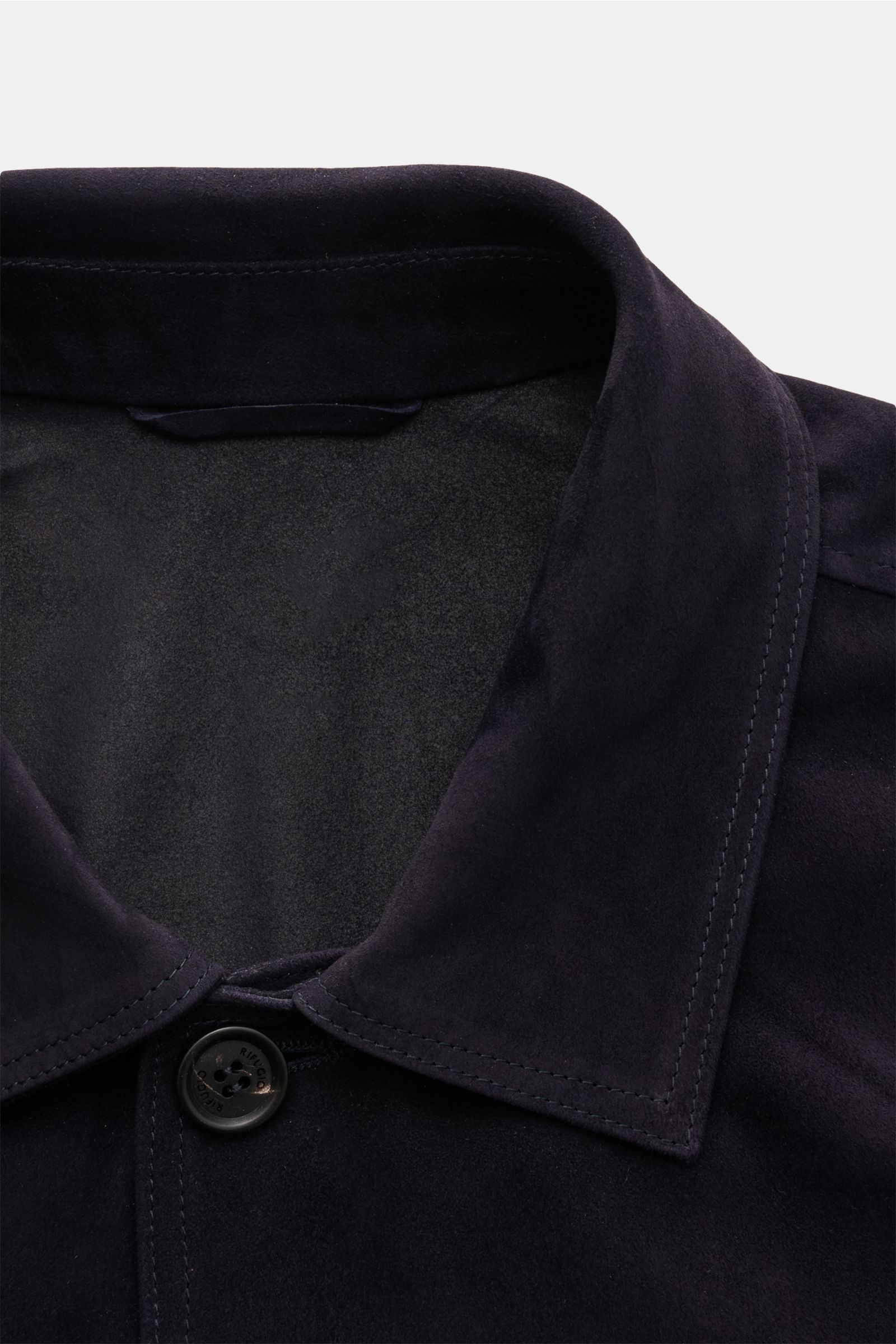 Close-up front top view of Rifugio Suede jacket dark navy showcasing its smooth suede, turn-down collar, and five-button placket, highlighting soft feel and slim fit. Confident elegance meets exquisite workmanship in this velvety-soft leather jacket with 