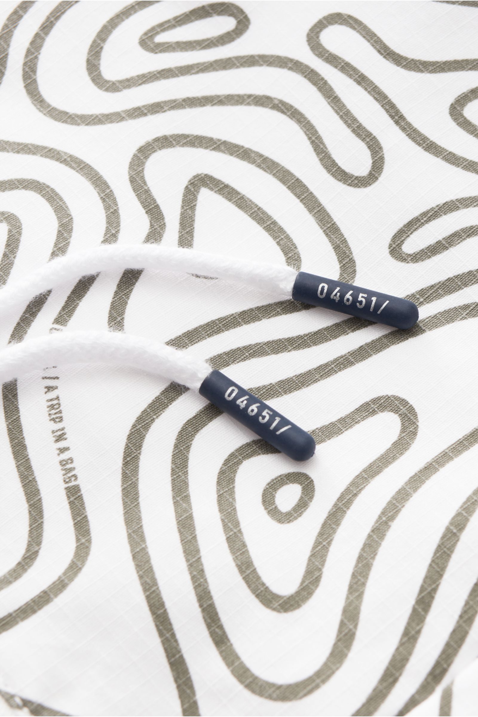 04651/ A trip in a bag Windbreaker 'Seamap' weiß/oliv gemustert