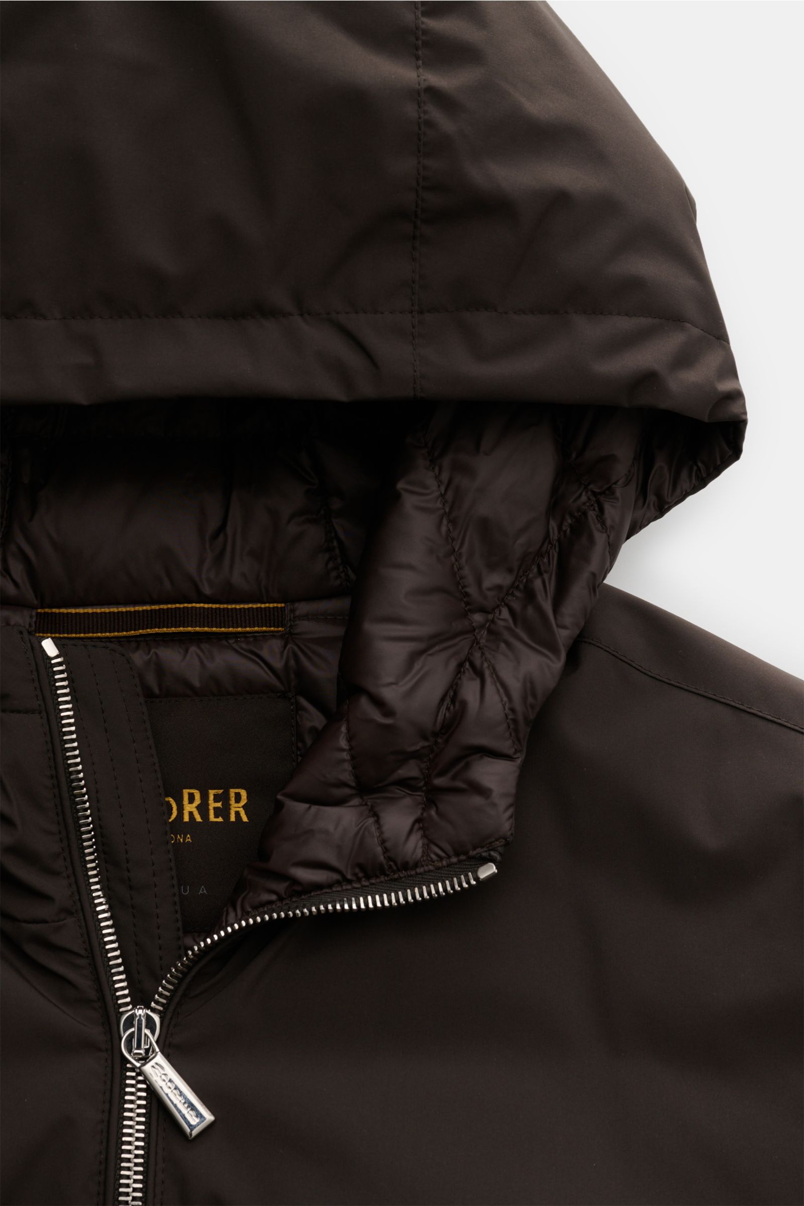 Close-up front view of Moorer Down blouson 'Oniro' dark brown showing zipped collar, quilted lightweight down lining, and water repellent microfiber hood. Maximum function in incredibly lightweight fabric: The sporty down blouson 'Oniro' has a warm down l