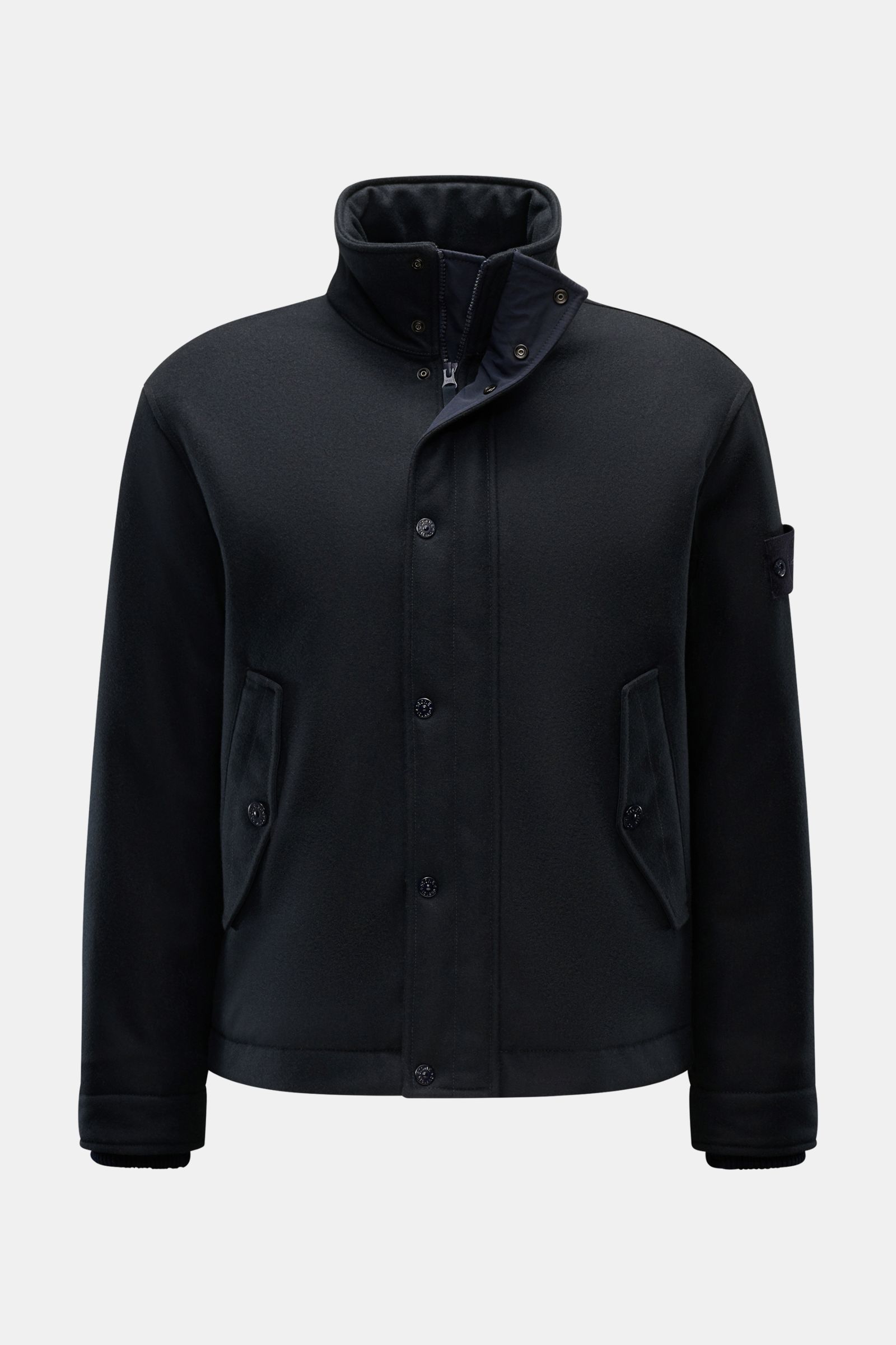 Front view of Stone Island Jacke 'Wool Nylon Flannel Ghost Piece' navy, a slim fit jacket made from water-repellent mix of wool and nylon flannel, featuring a high collar with two-way zipper, wind flap with buttons, angled flap pockets, tonal compass badg