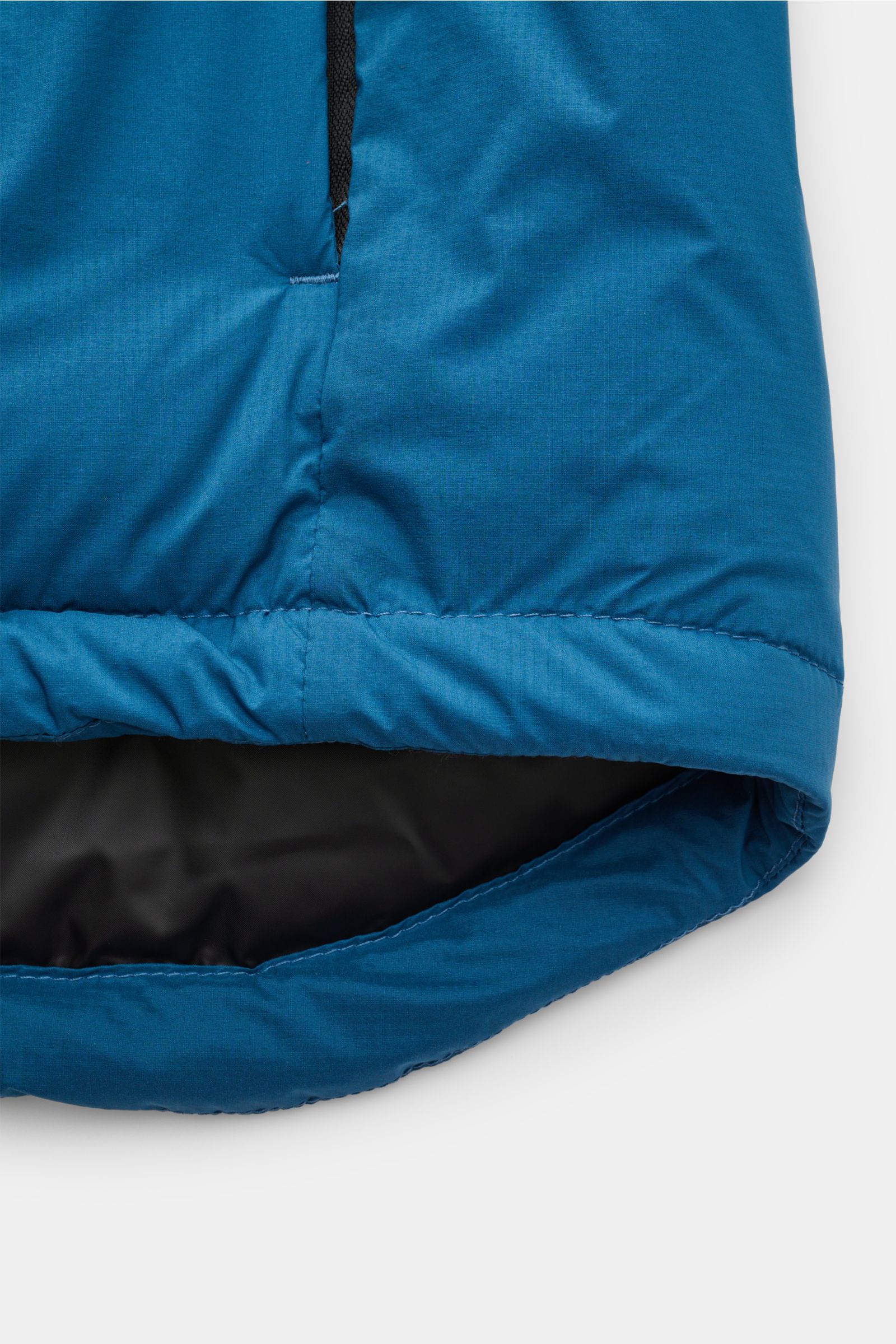 Blue Canada Goose Down jacket 'Lodge Hoody' showing a close-up of the slightly elongated back hem from above; padded hood, ripstop microfibre fabric, lightweight down lining, wind and water repellent, self-stowing, slim fit, two-way zip, drawstring hood, 