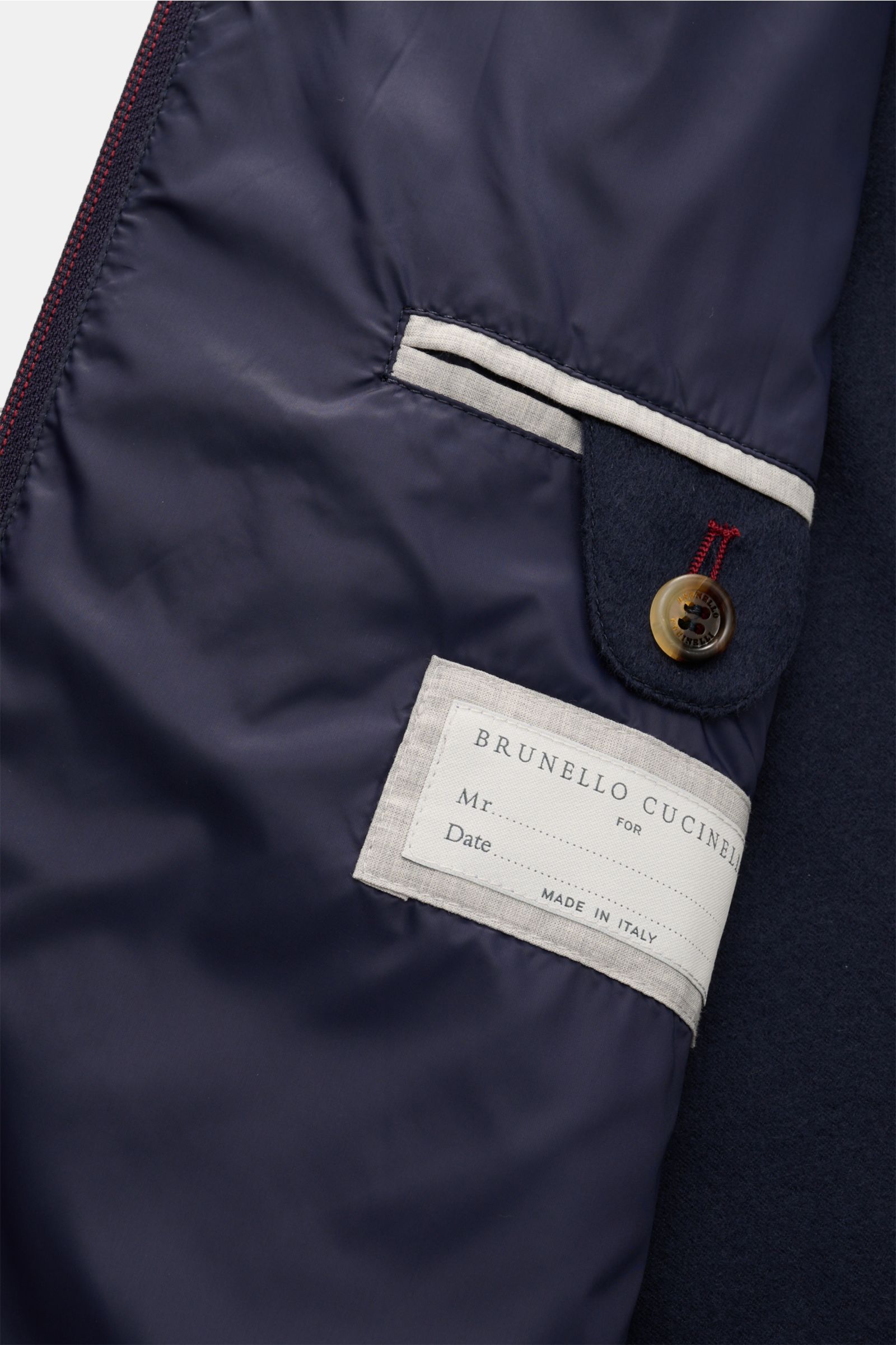 Innenansicht des Brunello Cucinelli Cashmere Blouson navy mit feiner Innenfütterung, zwei Innentaschen und elegantem Knopfverschluss.