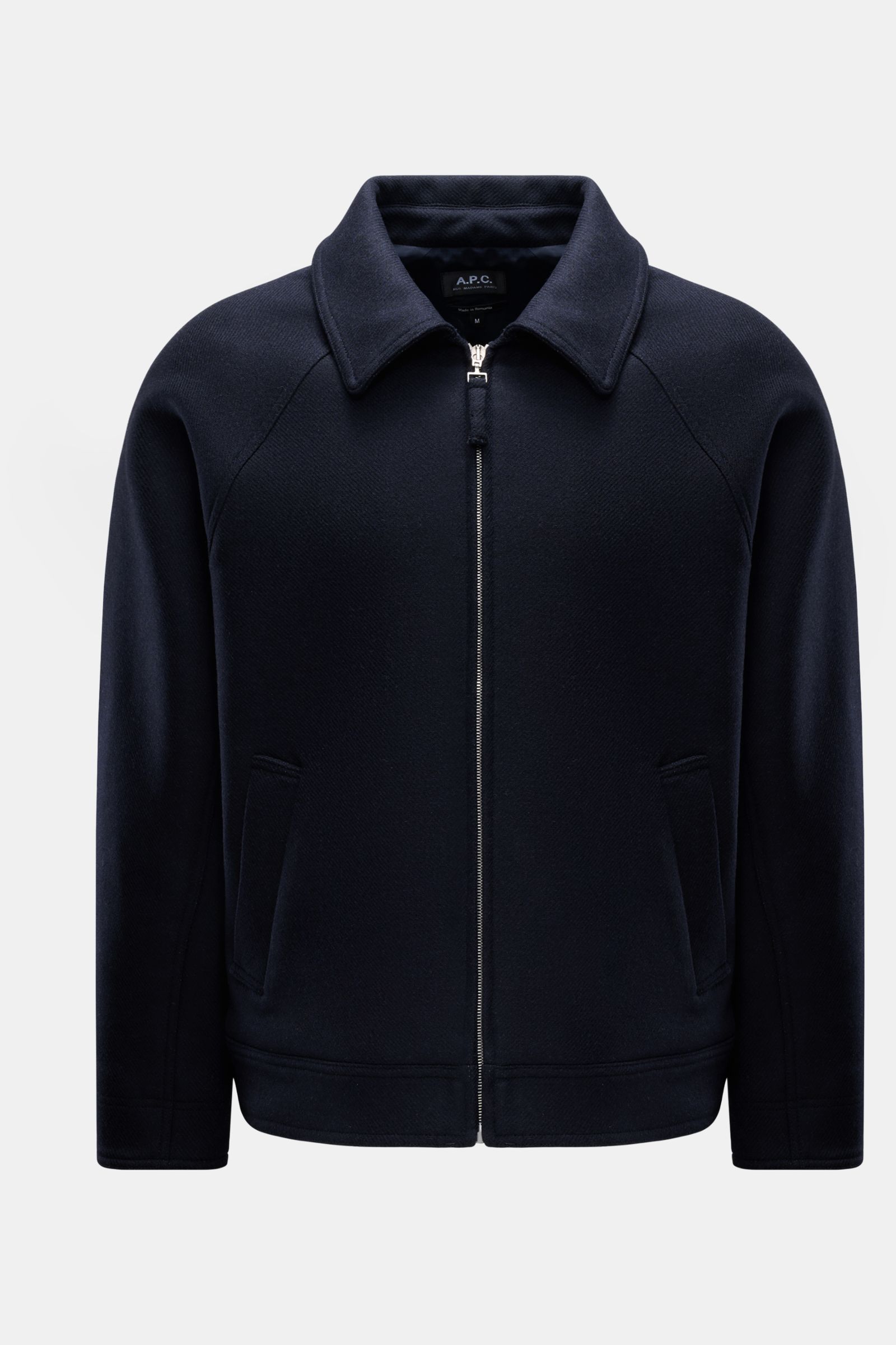 Front view of A.P.C. Jacke 'Chase' navy, a sporty wool-microfiber mix jacket with a regular fit, zip closure, turn-down collar, raglan sleeves, slanted welt pockets, and pure viscose lining, offering a lightly textured feel and urban style. Die Jacke '