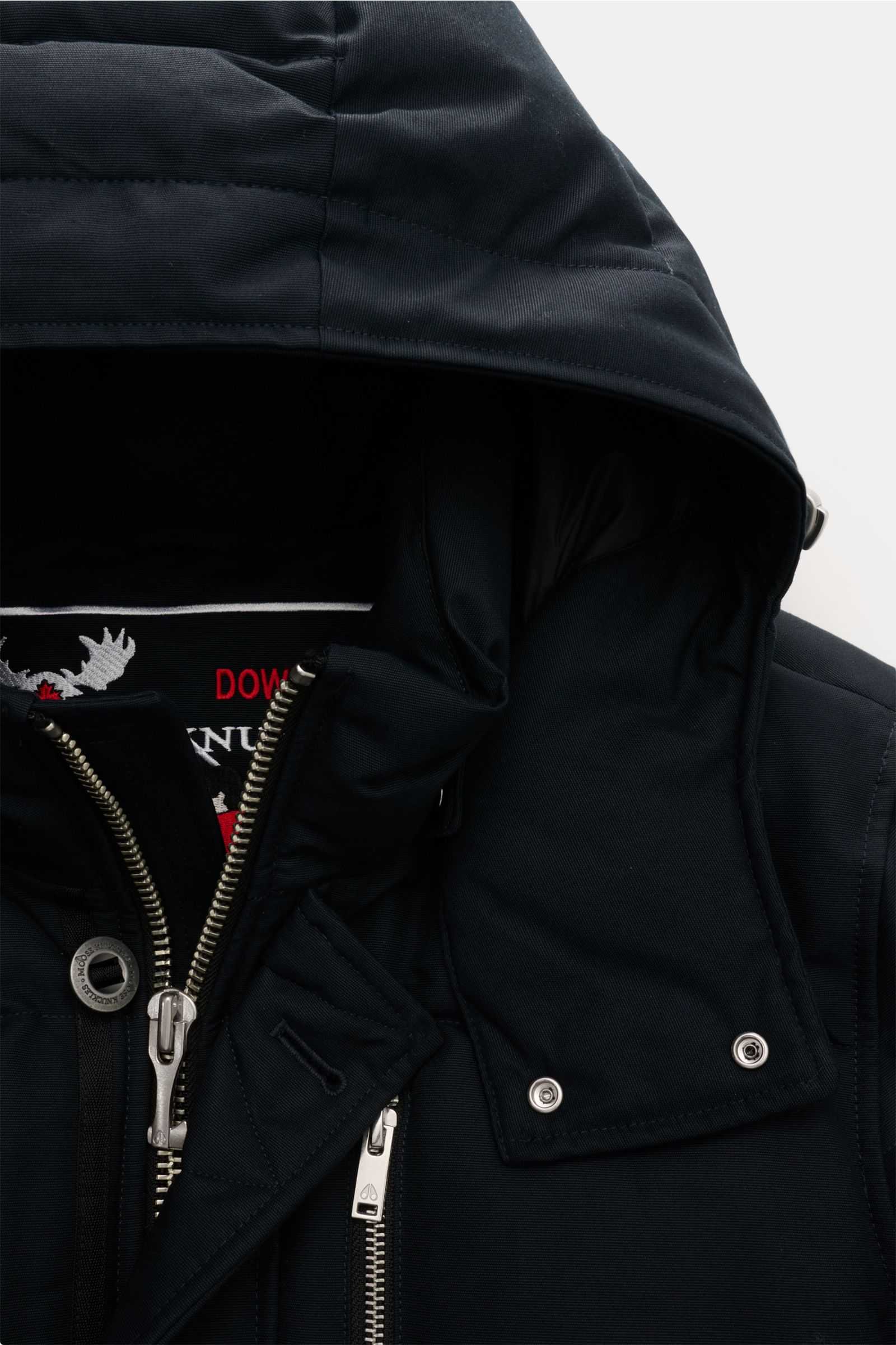 Close-up front view of the navy Moose Knuckles Down jacket 'Original 3q Neoshear' showing the detachable hood, zippered closure, and metal buttons. Effortlessly protects against even extreme cold: With its high-quality 90/10 down lining, this MOOSE KNUCKL