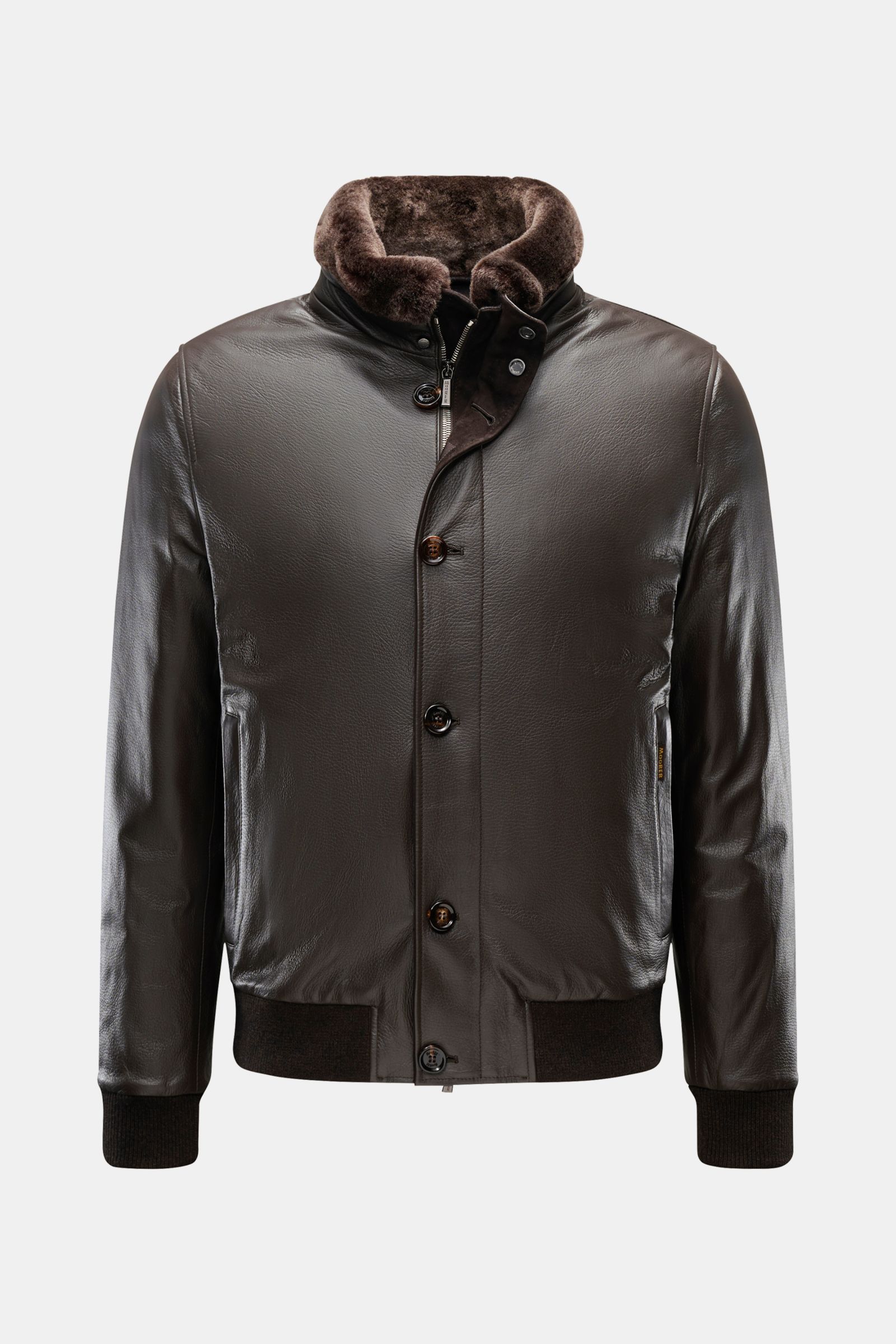 Front view of the Moorer Down leather blouson 'Cleros' dark brown, featuring smooth deerskin, soft feel, lightweight down lining, slim fit, two-way zip, storm flap with buttons, standing collar with detachable fur trim, slanted hip pockets, elastic hem an