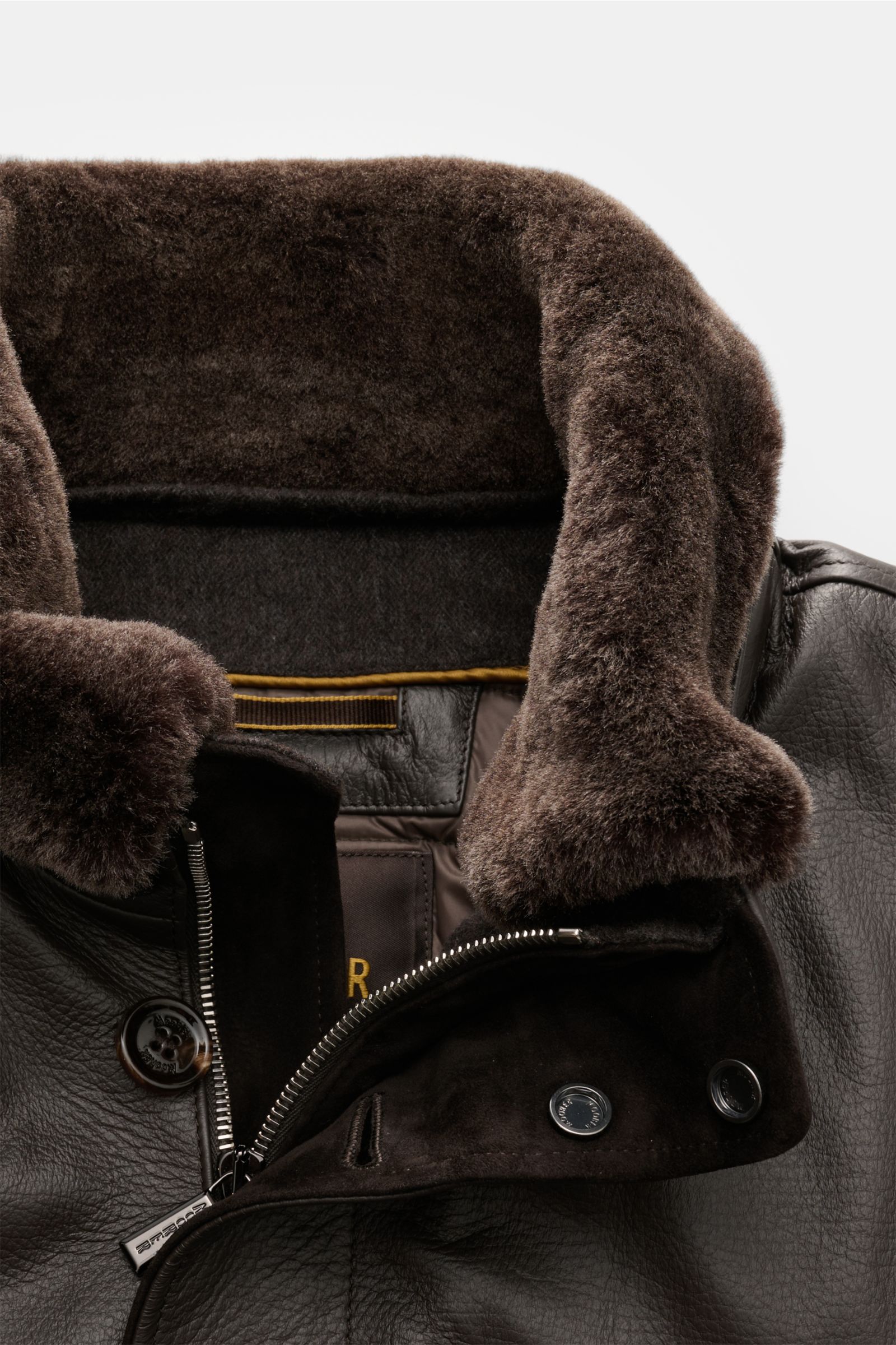 Close-up front view of Moorer Down leather blouson 'Cleros' dark brown with smooth deerskin, soft fur collar, two-way zip, storm flap, and button details.