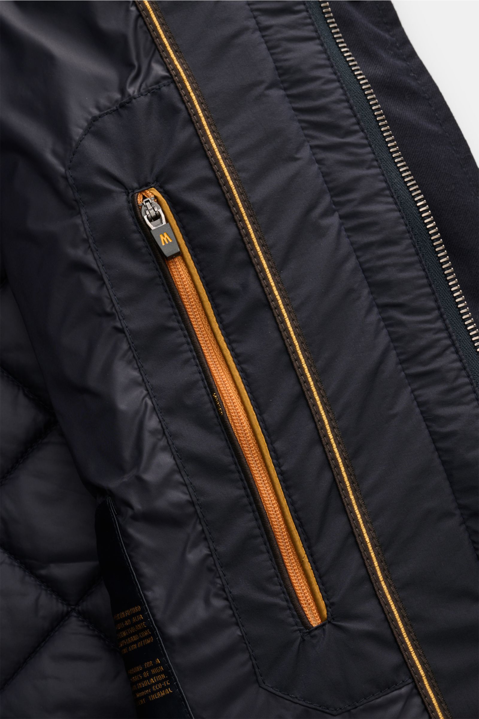 Close-up interior view of the Moorer Daunenjacke 'Zavyer' dark navy showing orange zipper pocket and quilted lining, featuring lightweight down filling, high-quality cotton, smooth soft touch, classic quilting, water-repellent, slim fit, leather collar de