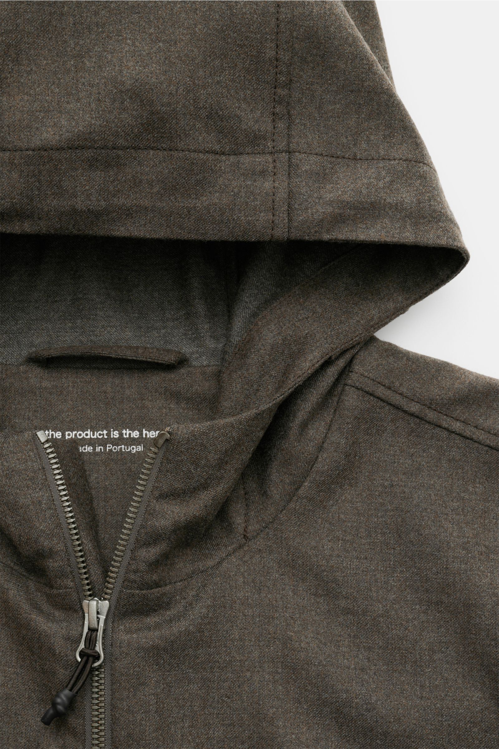 Close-up top view of The Product is the Hero Blouson 'Billy' grey-brown mottled, showing the hood, two-way zip, and soft virgin wool blend fabric.
