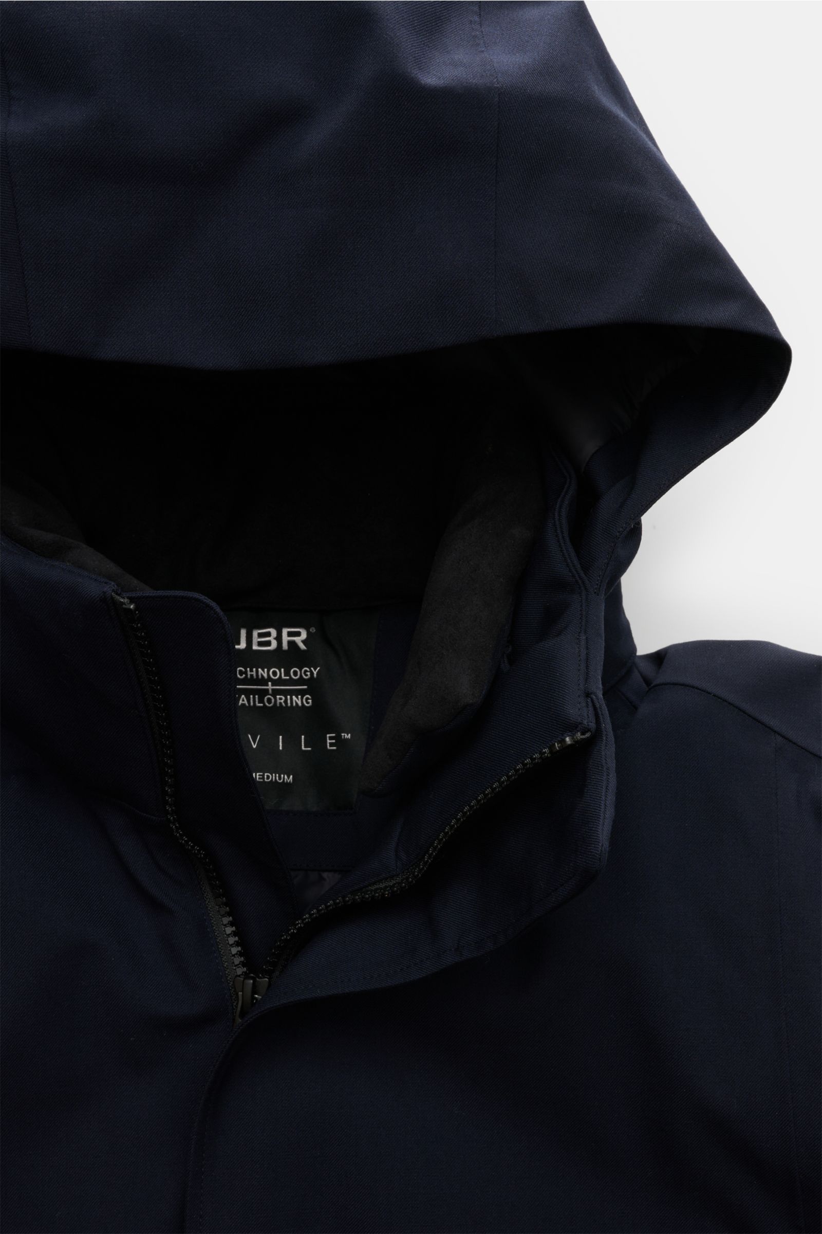 Close-up front view of the UBR Parka 'Regulator Parka Savile' navy, showcasing the hood, zipper, and collar details. A stylish blend of Merino wool twill and microfiber with lightweight Primaloft insulation, waterproof membrane, taped seams, slim fit, two