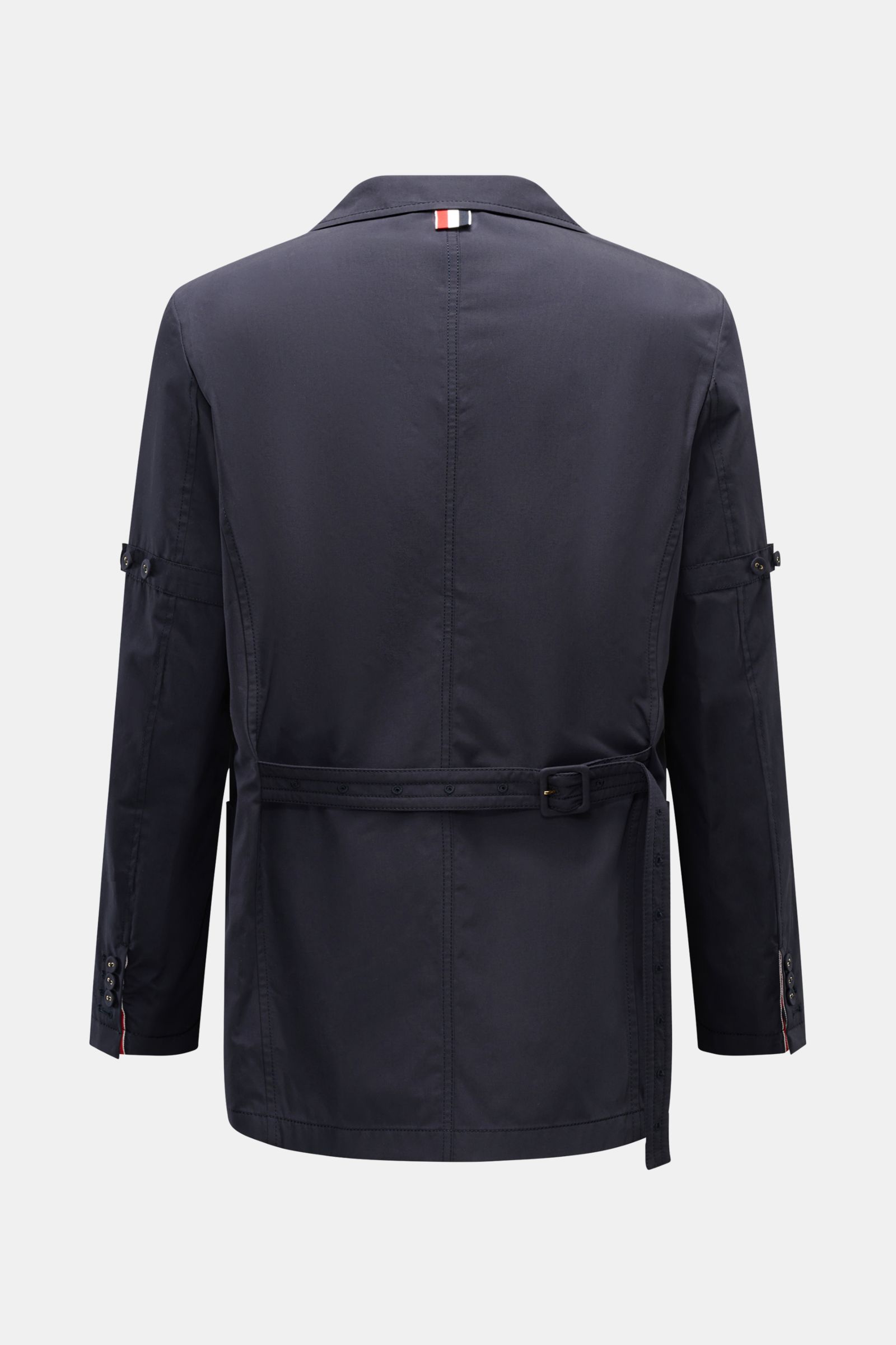 Back view of Thom Browne Jacket navy in pure cotton with adjustable collar, slim fit, waist tab, and four-button placket.

Description: 
Elegant outdoor essential: The THOM BROWNE jacket impresses with the timeless design of a smart-casual jacket, maki