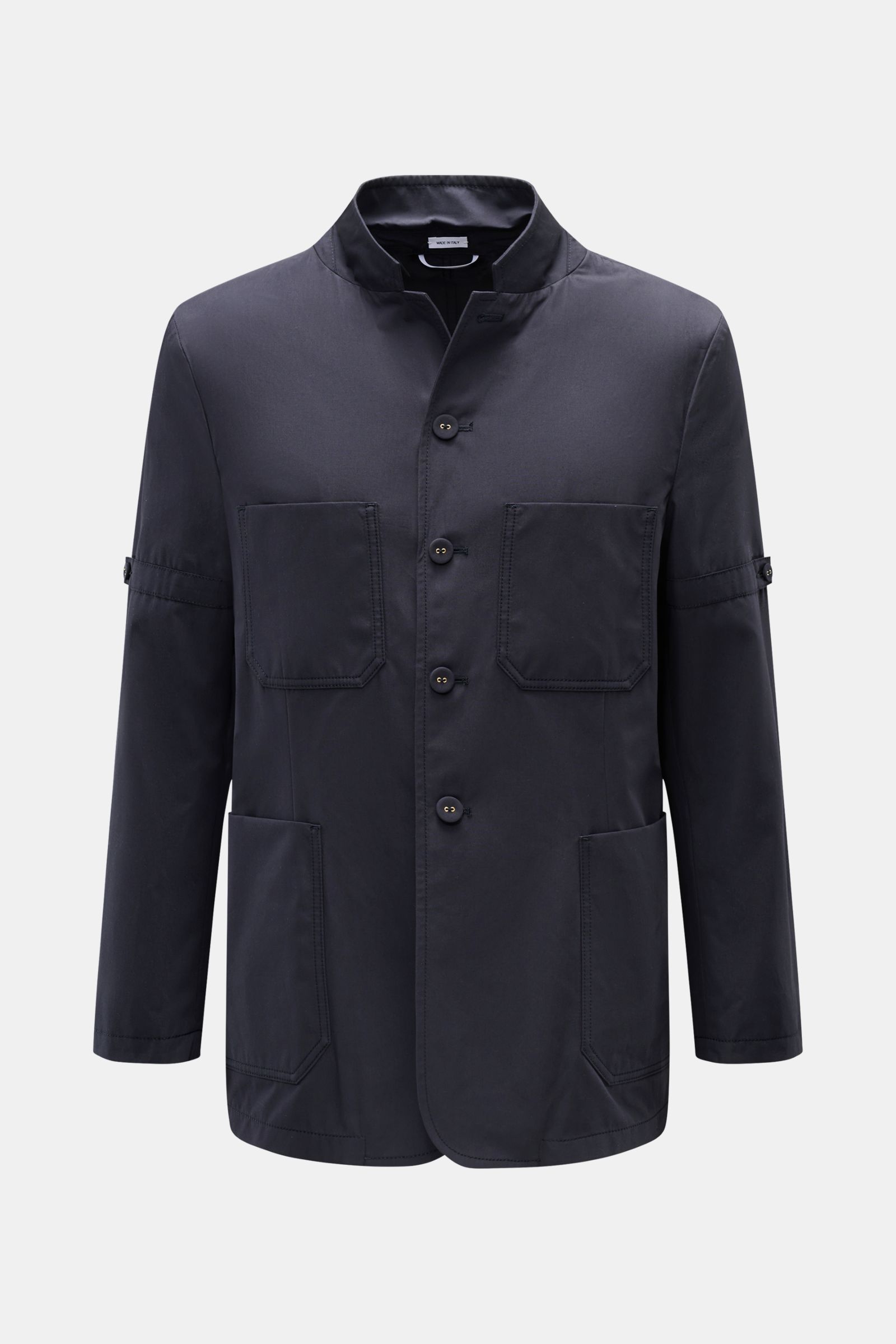 Front view of Thom Browne Jacket navy in pure cotton with slim fit, four-button placket, adjustable collar, four front pockets, sleeve ends with kissing buttons, waist tab at the back, and two inside pockets, soft feel. Elegant outdoor essential: The THOM