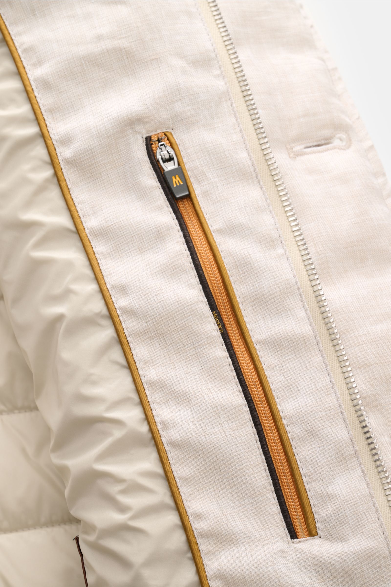 Close-up front view of the Moorer Down jacket 'Zavyer' beige mottled, showing pure linen fabric, smooth feel, classic topstitch, orange two-way zip with leather detail, lightweight down lining, storm flap with buttons, classic breast pocket, hip pockets w