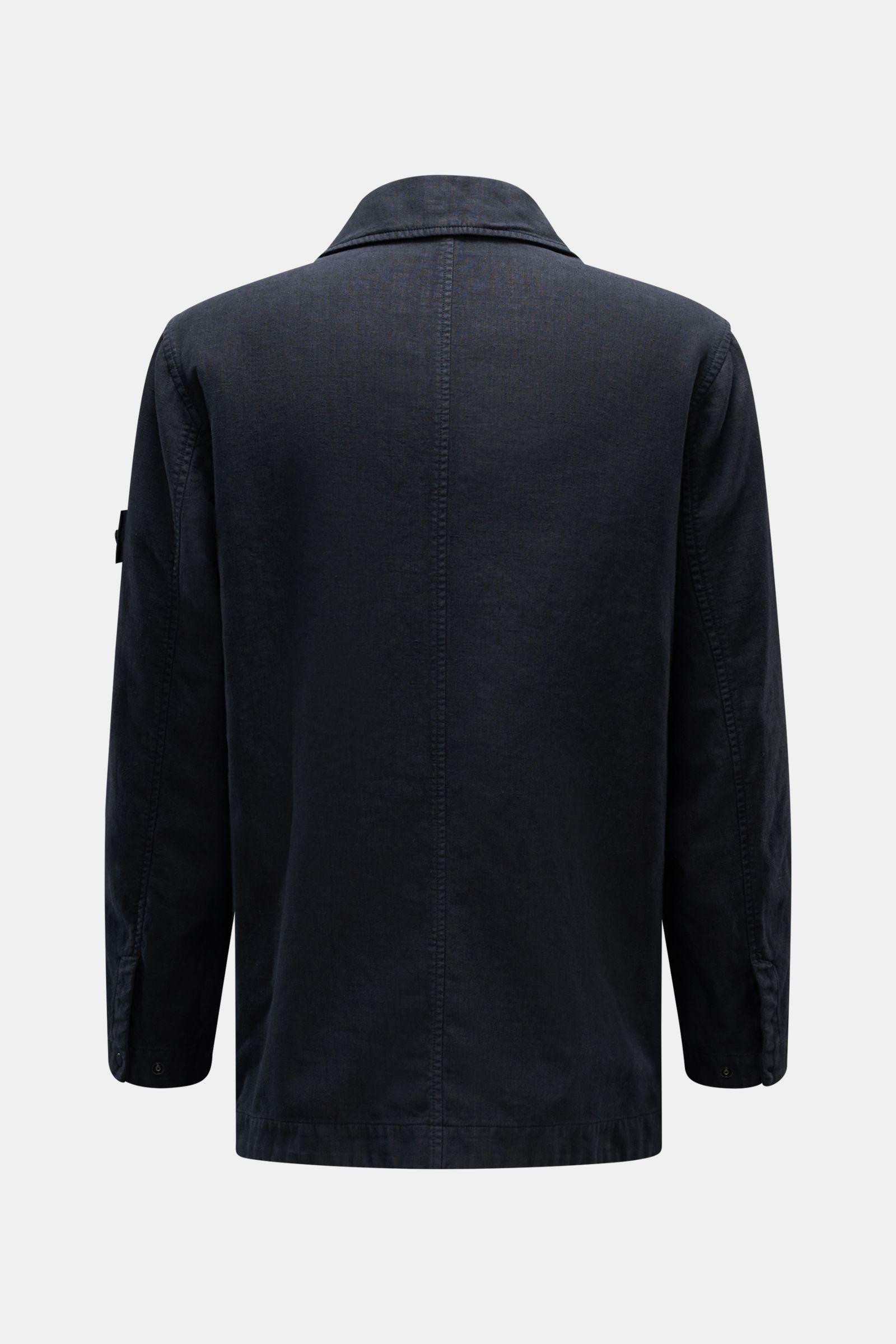 Rear view of Stone Island Jacket 'Ghost Piece' navy in a linen and microfiber blend, featuring a slim fit, adjustable collar, and tonal sleeve badge. Springtime meets casual with concealed button placket, hip flap pockets, and snap-button cuffs.