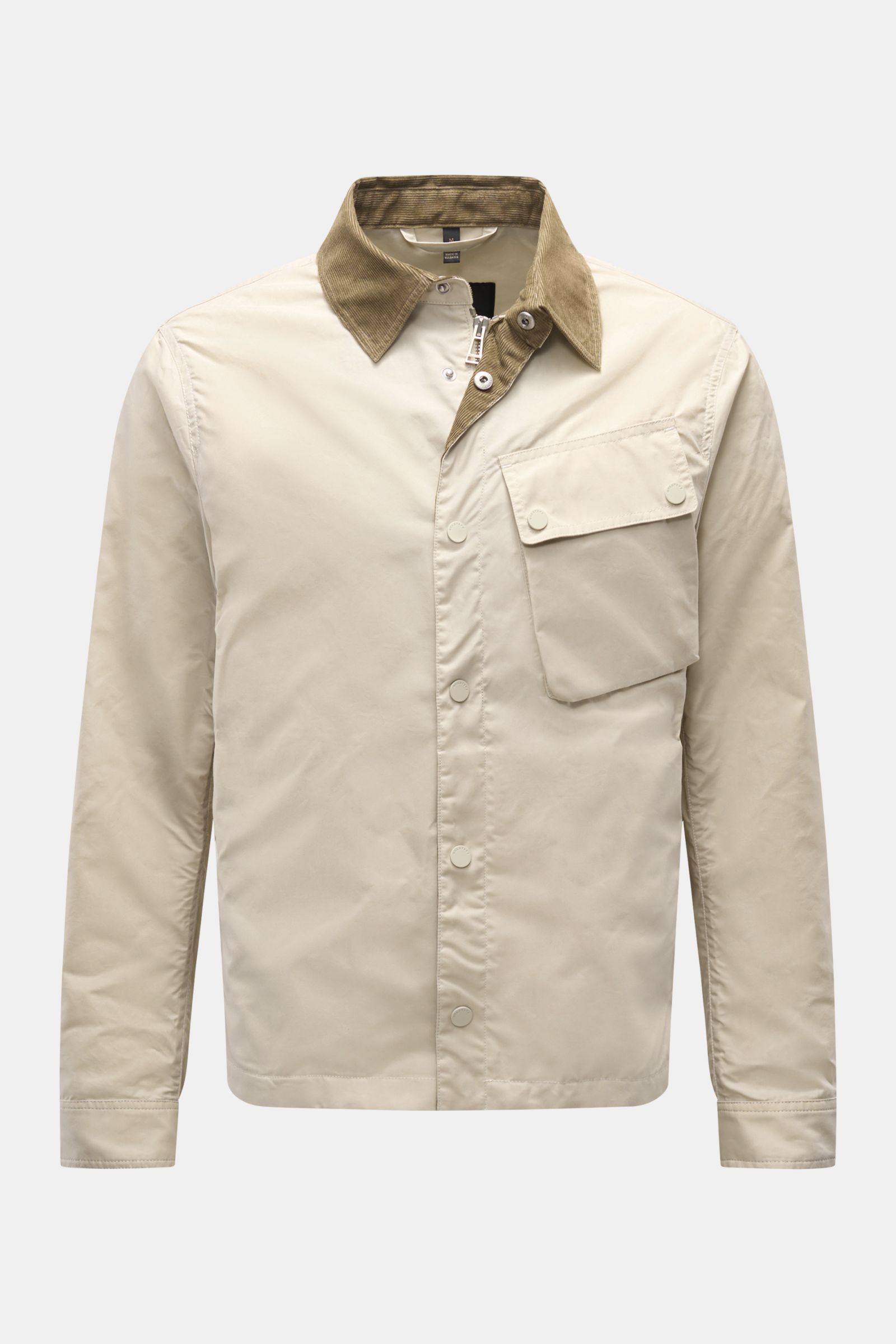 Front view of Belstaff Jacket 'Ground' cream/taupe made from waxed cotton with a boxy cut and corduroy-trimmed turn-down collar, featuring a robust zip, storm flap with snap buttons, large patch breast pocket with flap, cuffs with snap button, BELSTAFF wo