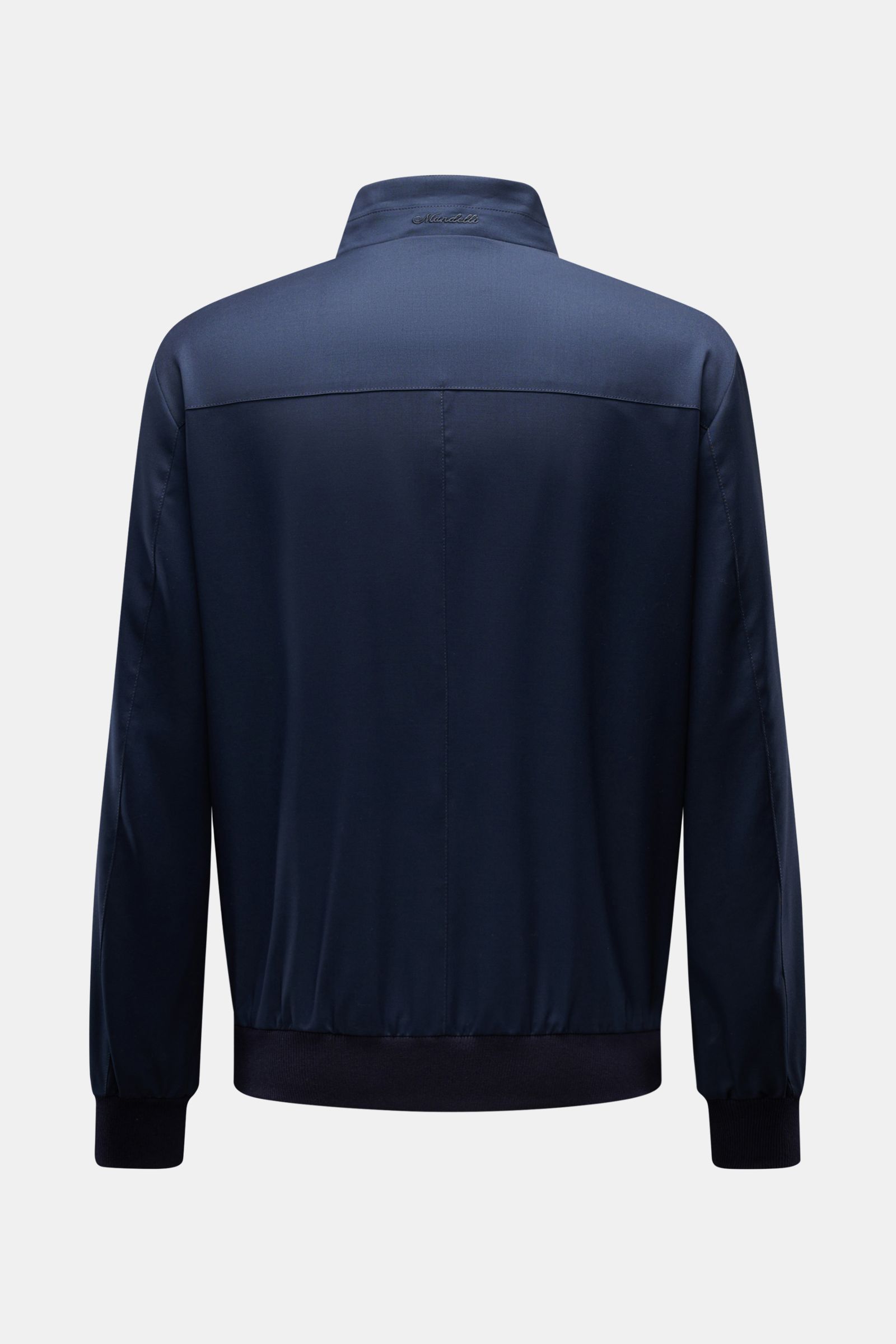 Back view of Mandelli Blouson navy in pure wool with standing collar, slim fit, two-way zip, elastic hem and cuffs, smooth lining, and three inside pockets, photographed against a plain background. Elegant ease for the transitional period: this blouson by