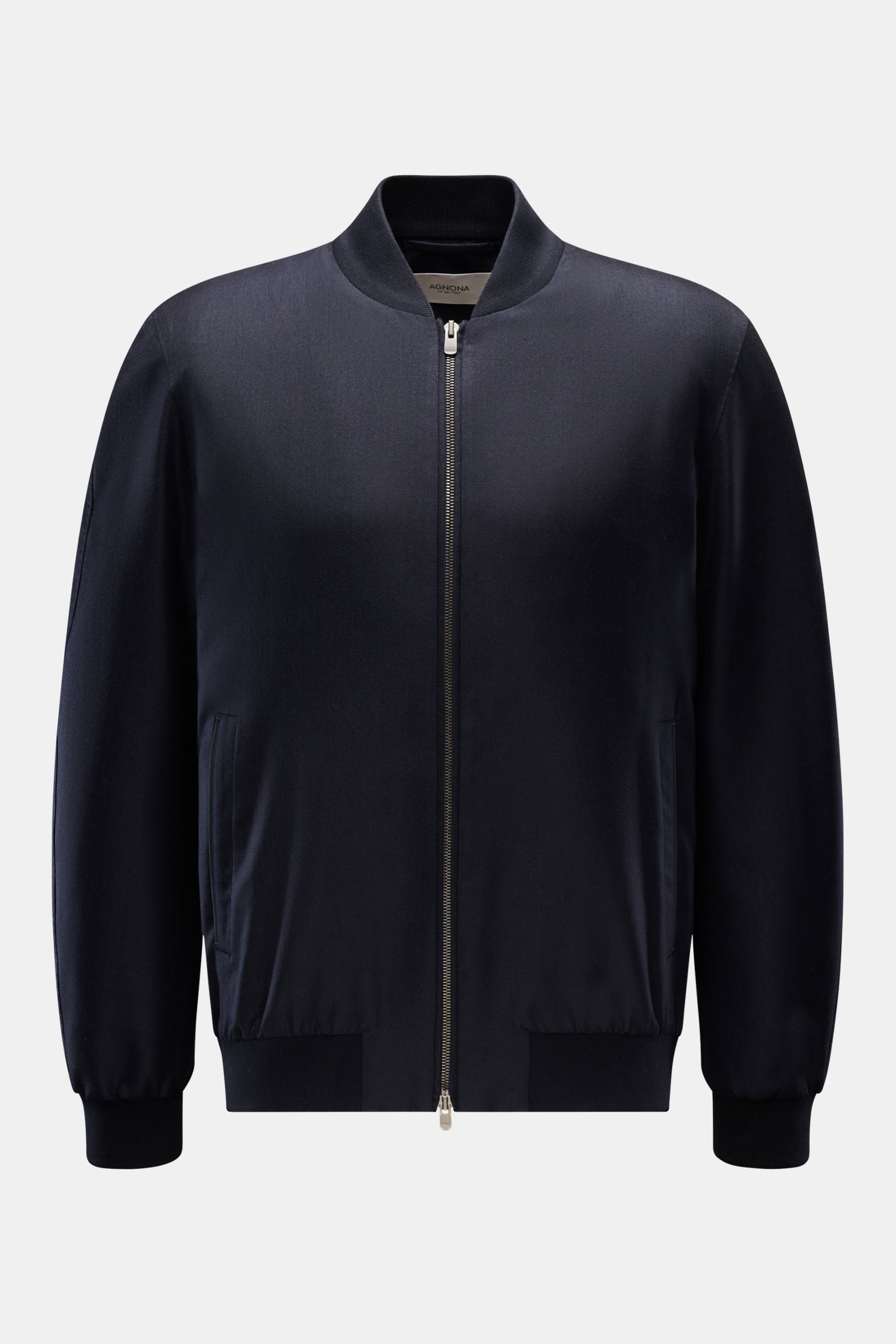 Front view of Agnona Blouson navy, a slim fit, sporty luxury jacket made from a blend of cashmere and silk with calfskin piping.

Description: Sporty luxury perfected – AGNONA presents an exclusive cashmere and silk blouson that combines rare natural f