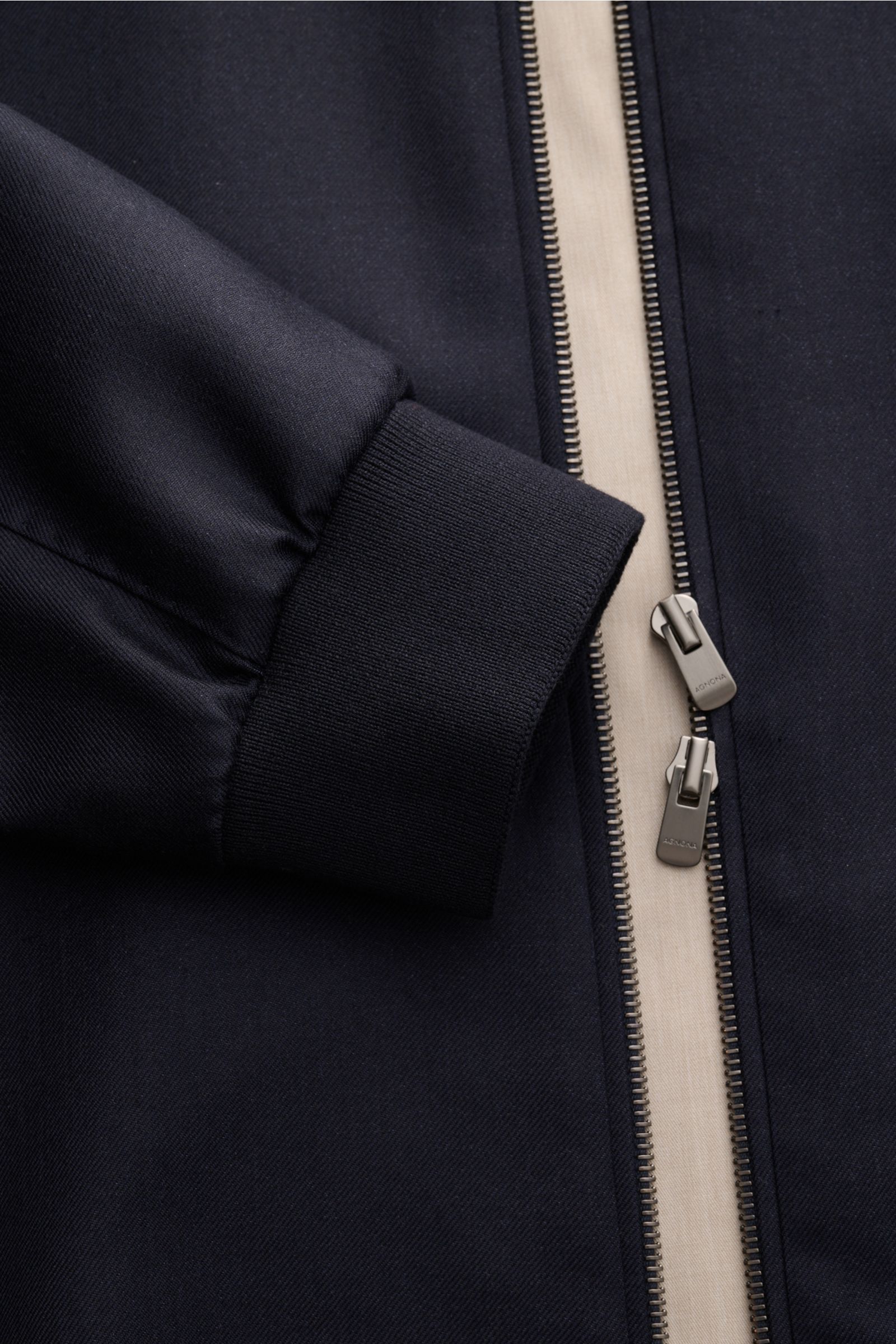 Close-up front view of Agnona Blouson navy showing ribbed cuff, two-way silver zipper, and navy fabric texture.

Description: Sporty luxury perfected – AGNONA presents an exclusive cashmere and silk blouson that combines rare natural fibres with exquis