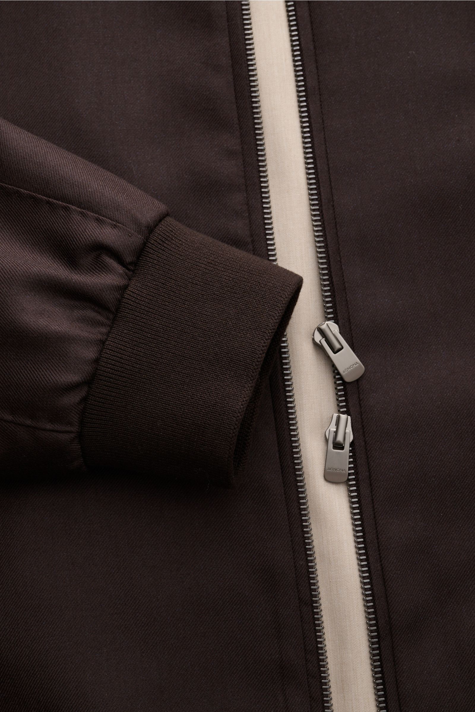 Close-up front view of the Agnona Blouson dark brown showing rib knit cuff and two-way zip with fine calfskin piping. Sporty luxury perfected – AGNONA presents an exclusive cashmere and silk blouson that combines rare natural fibres with exquisite high-en