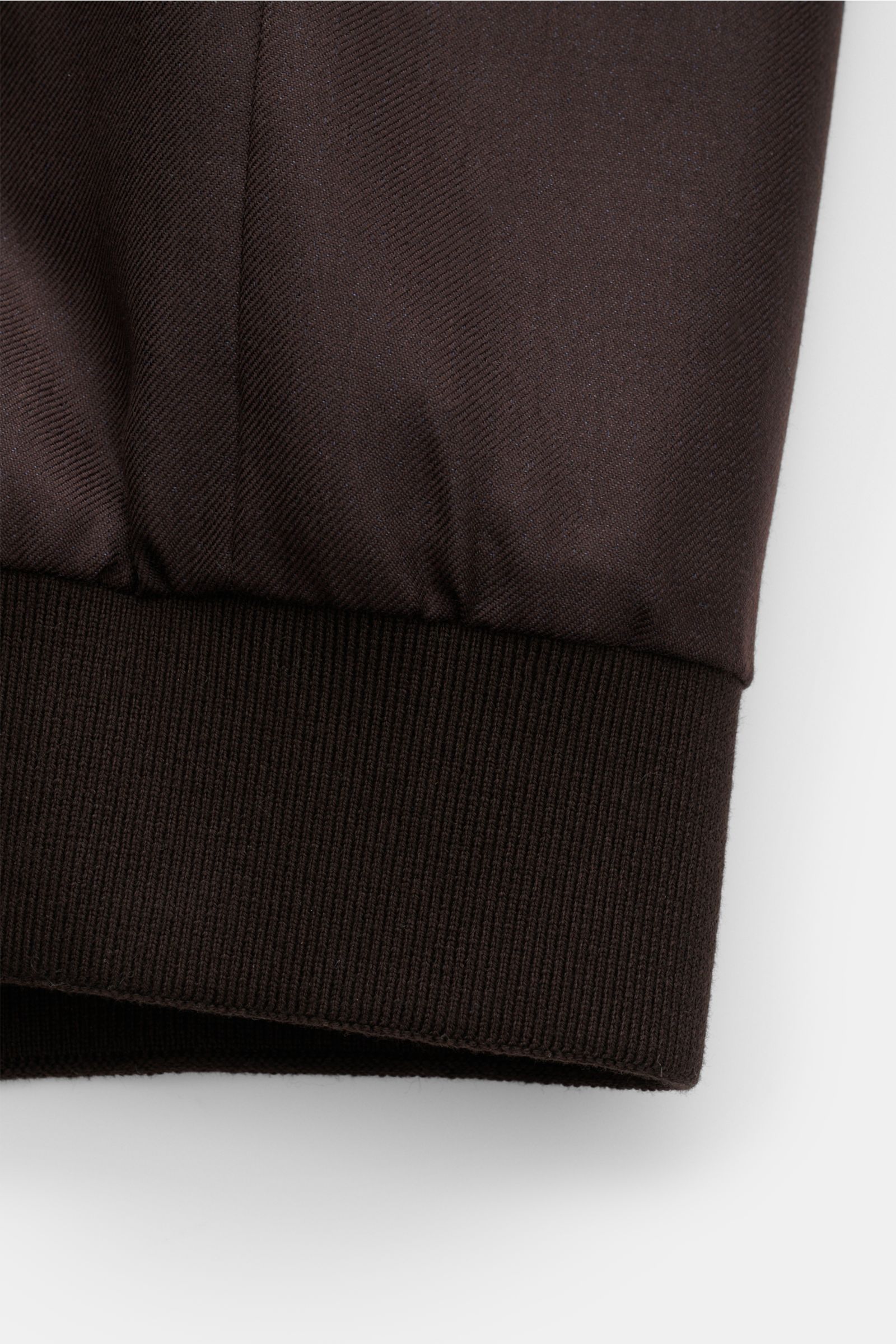 Alt tag (125 characters max):
Close-up side view of the ribbed cuff of the Agnona Blouson dark brown made from cashmere and silk blend fabric.

Description incorporating provided content:
Sporty luxury perfected – AGNONA presents an exclusive cashmere 