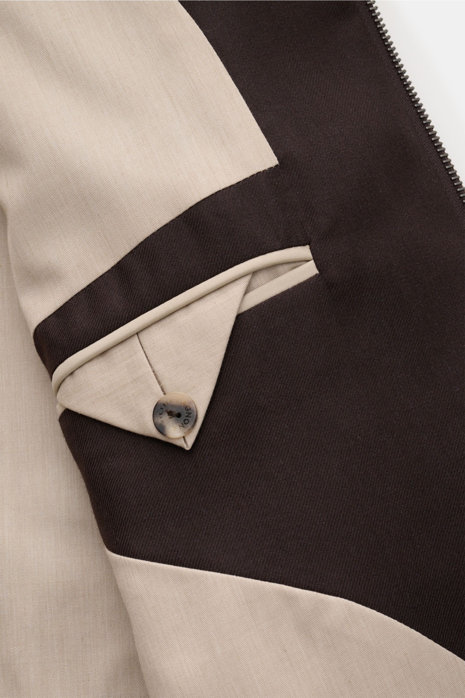 Close-up view of the inside pocket and stitching detail of the Agnona Blouson dark brown, showcasing fine natural fibres and craftsmanship.

Description: Sporty luxury perfected – AGNONA presents an exclusive cashmere and silk blouson that combines rar