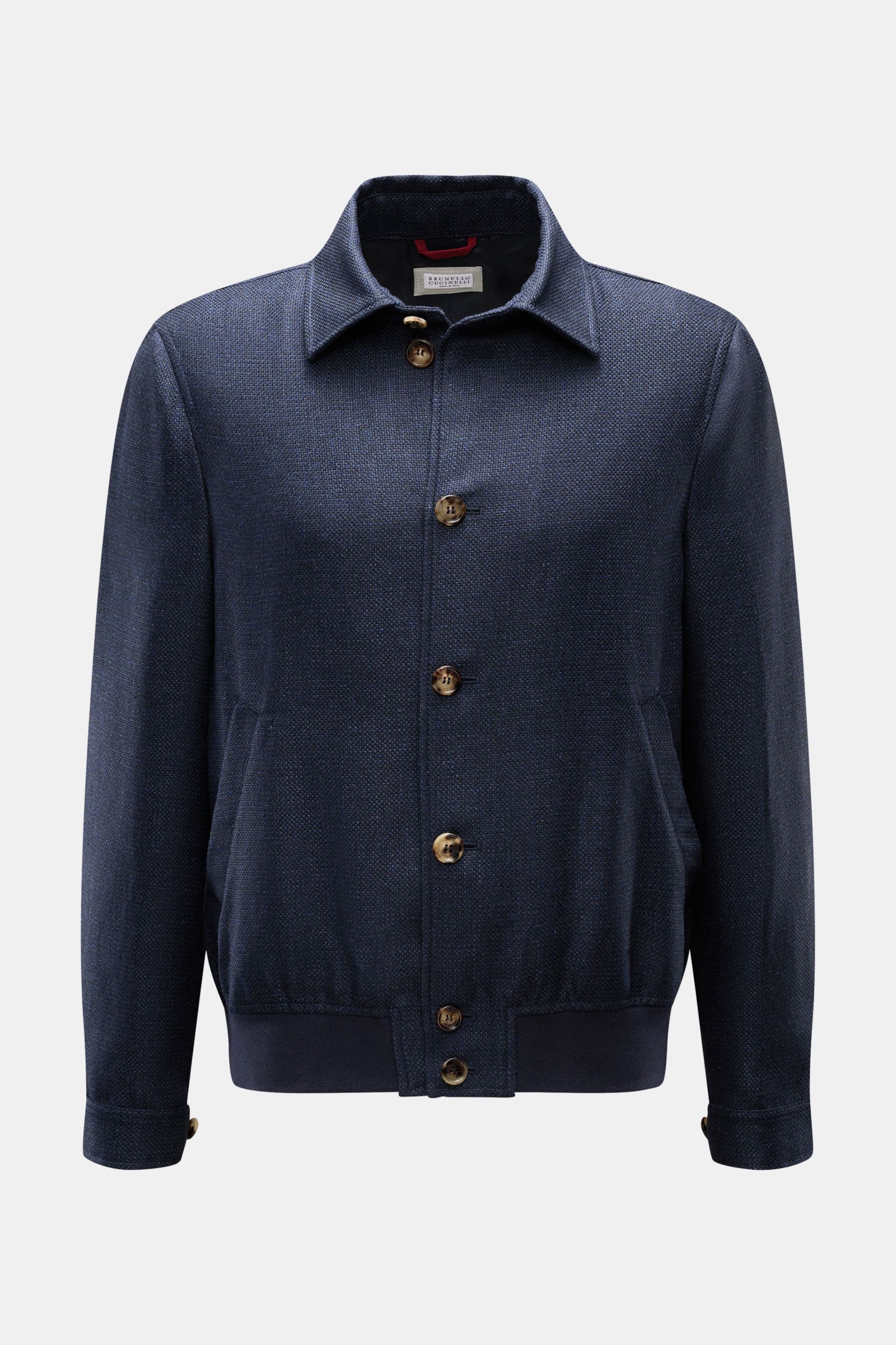Front view of Brunello Cucinelli Blouson navy mottled, lightweight and elegant with a slim fit, silk, linen, wool blend, distinctive weave, seven-button placket, turn-down collar, slanted hip pockets with snap button, sleeves with cuffs, elasticated hem, 
