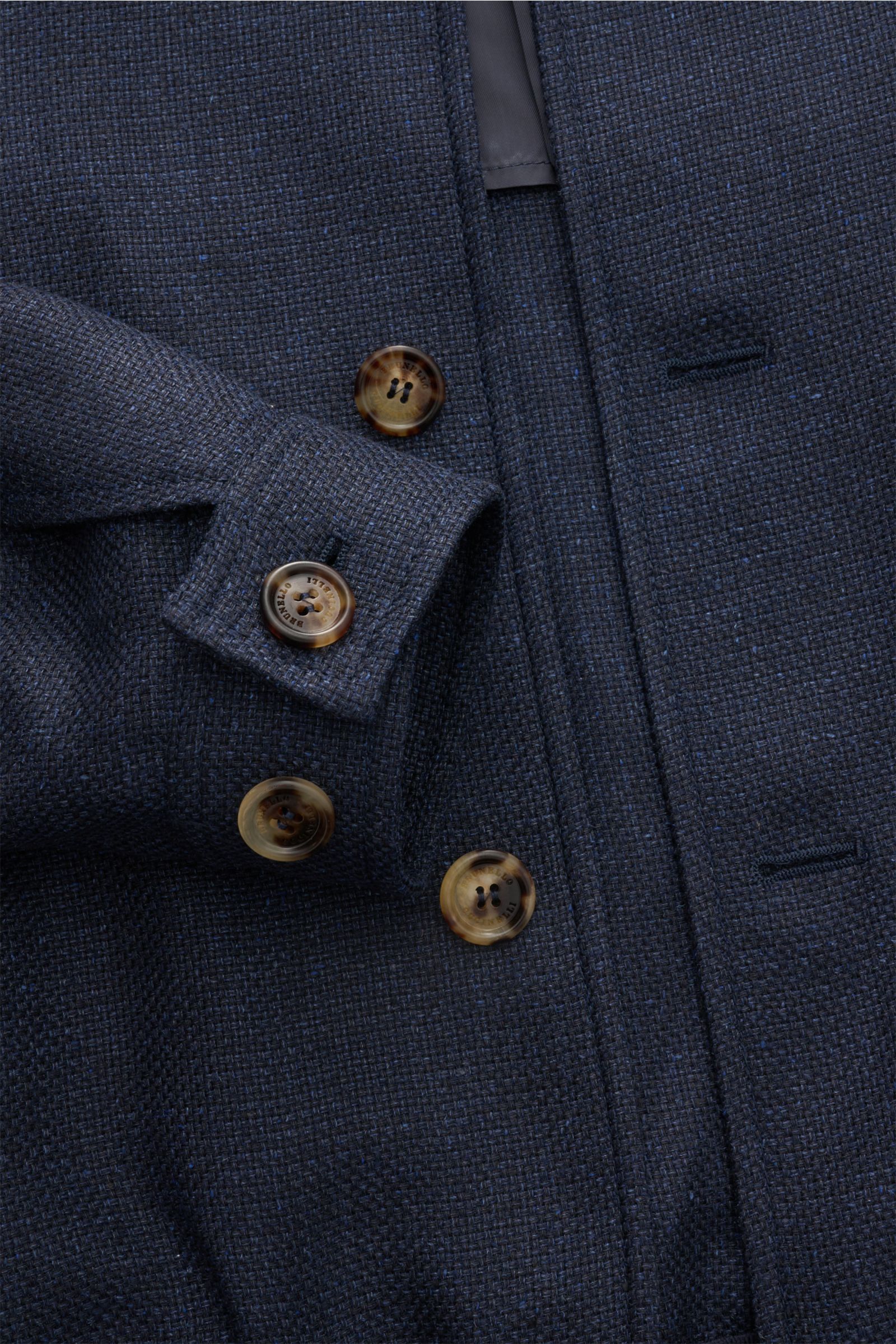 Close-up front view of Brunello Cucinelli Blouson navy mottled, showing its distinctive weave, seven-button placket, and cuff detail.