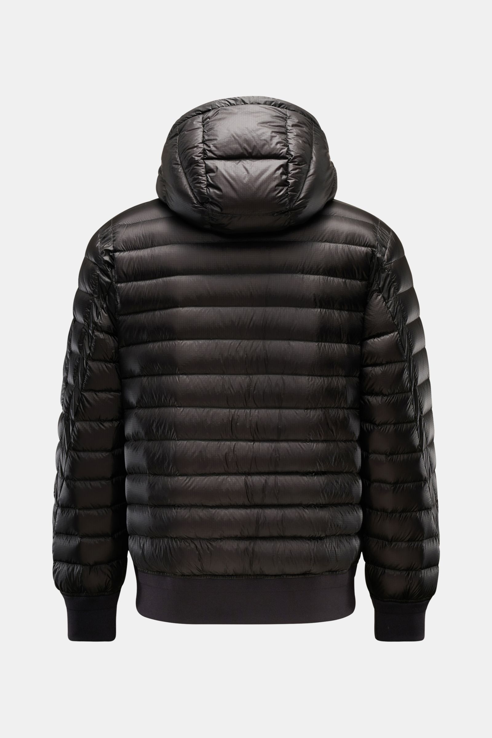 Rear view of C.P. Company Down bomber jacket black with hood, water repellent ripstop surface, lightweight down padding, slim fit, elastic cuffs and hem.

Description: Technical lightness in its most modern form: This blouson by C.P. COMPANY has a wate