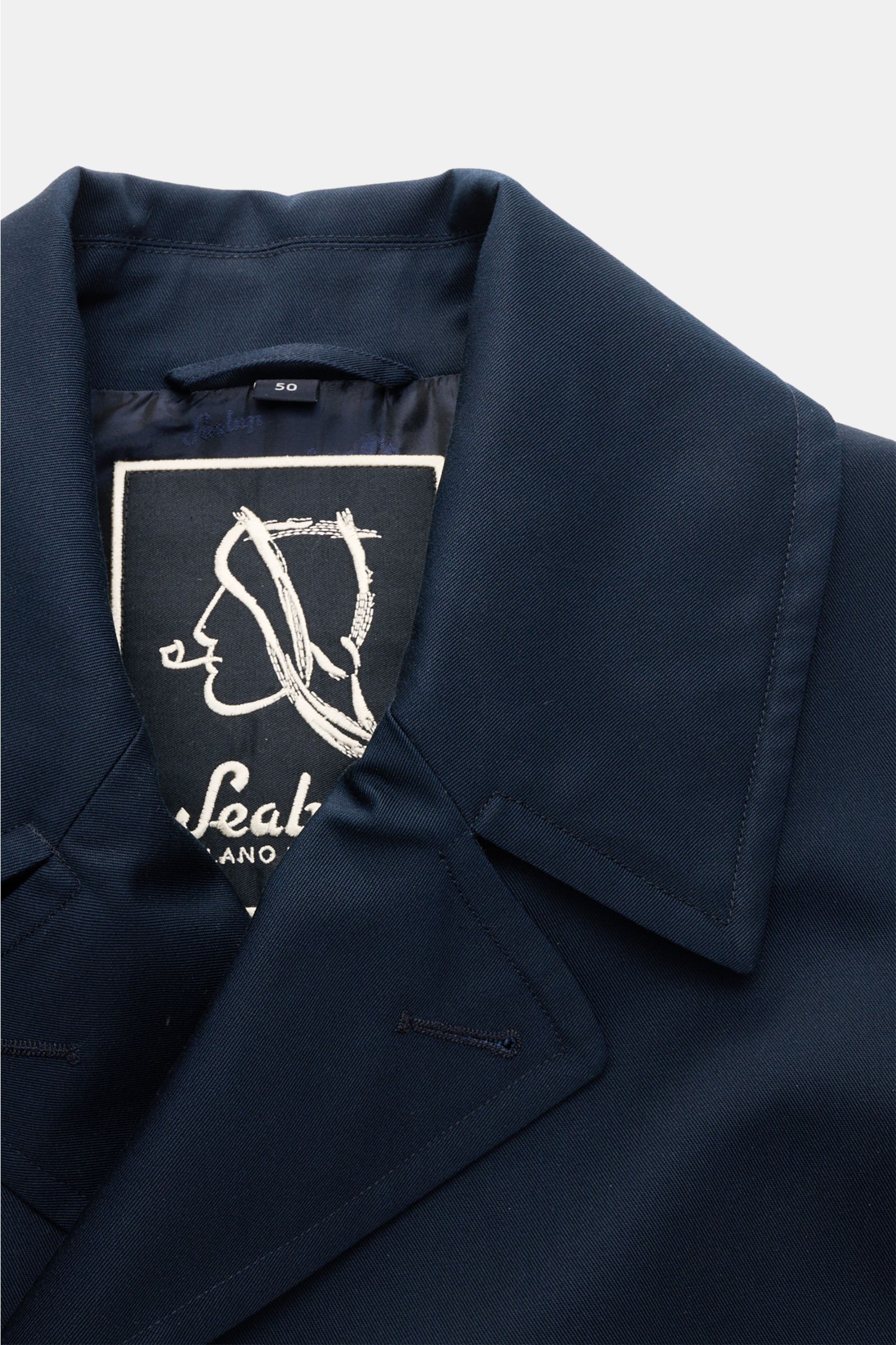 Close-up top front view of Sealup Pea coat 'Amalfi' navy showing wide lapel collar, fine twill fabric, and SEALUP logo inside. Get the look of a Hanseatic merchant with the elegant pea coat 'Amalfi' by traditional label SEALUP: made of lightweight twill i