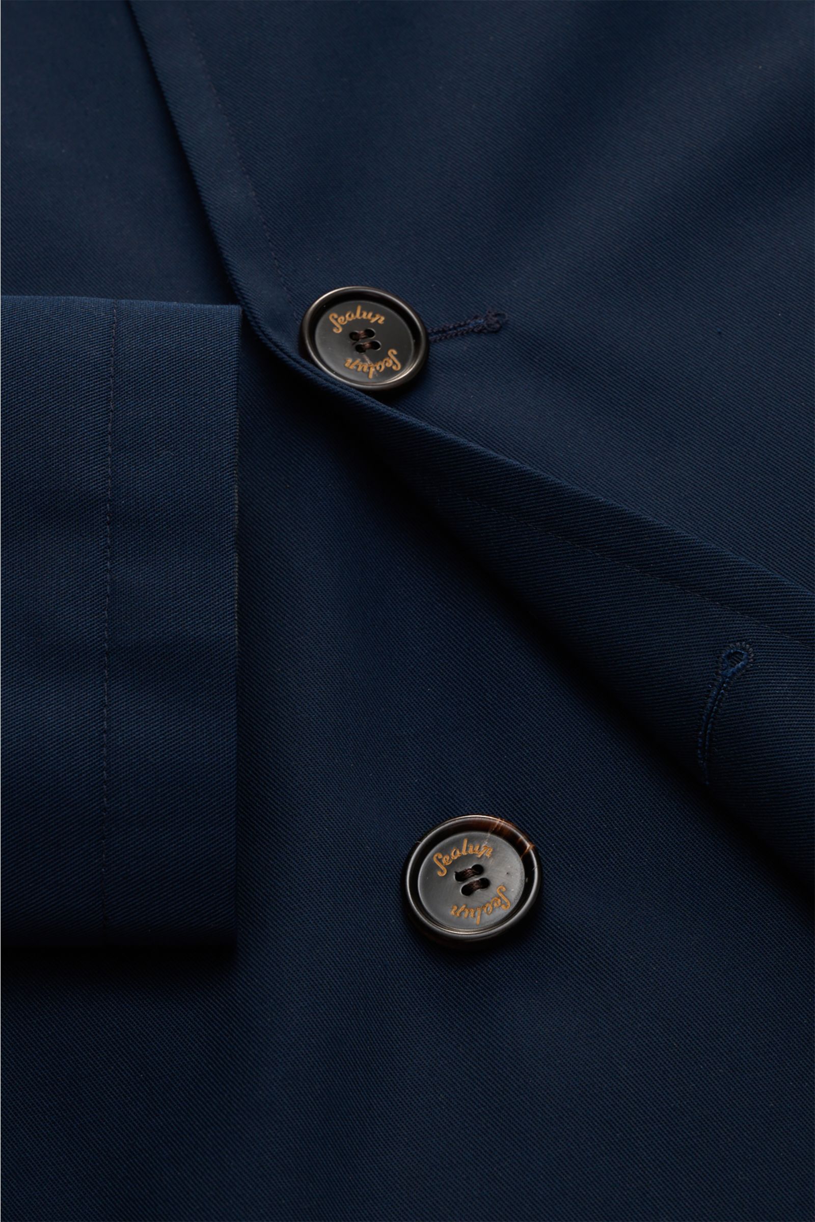 Close-up front view of Sealup Pea coat 'Amalfi' navy showing double-breasted three-button placket and fine twill fabric. Get the look of a Hanseatic merchant with the elegant pea coat 'Amalfi' by traditional label SEALUP: made of lightweight twill in a ba