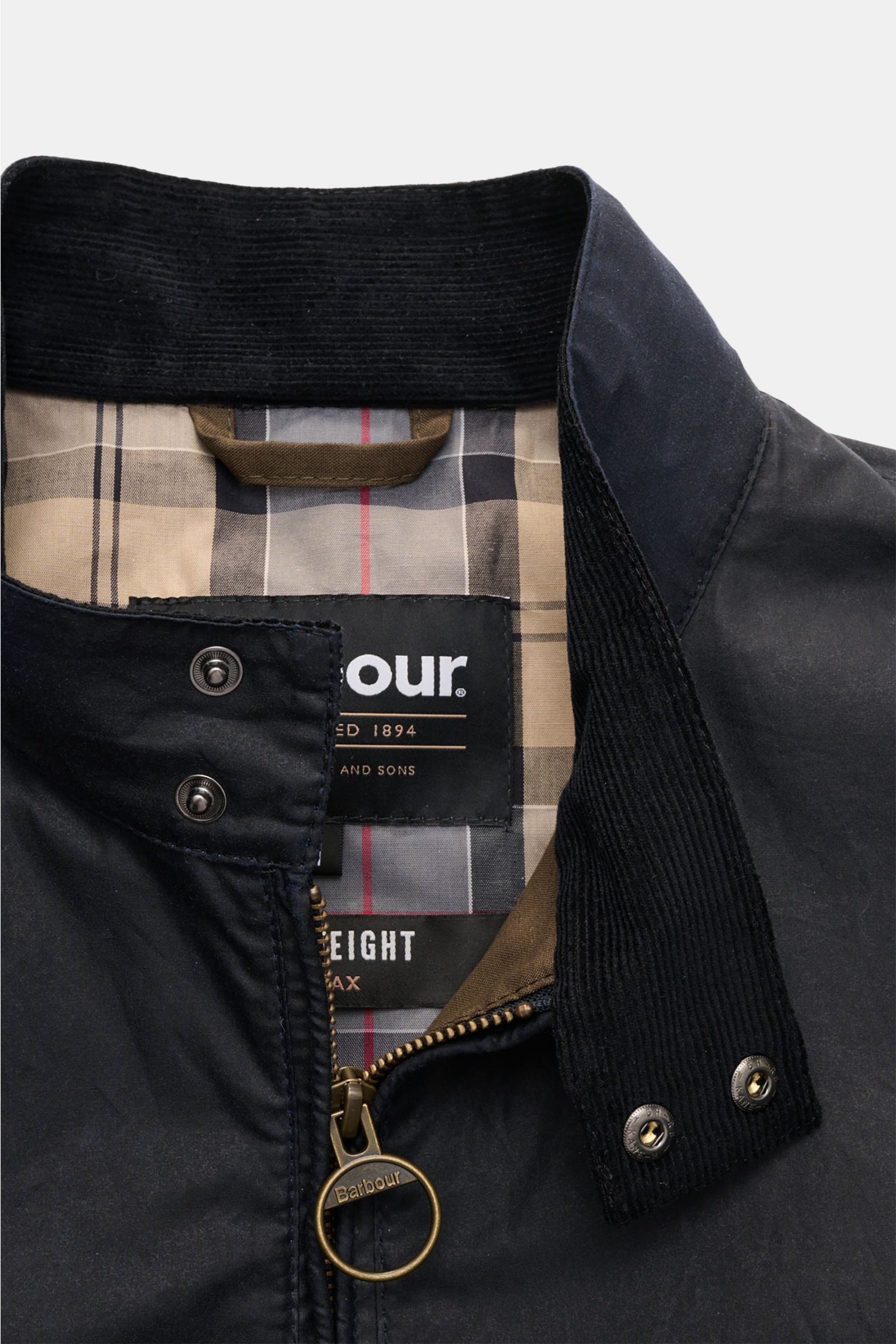 Close-up front view of Barbour Waxed blouson 'Royston' dark navy showing standing collar with corduroy trim, two snap buttons, and branded zipper pull.

Description: Classic blouson by traditional label BARBOUR: With its short cut and signature corduro
