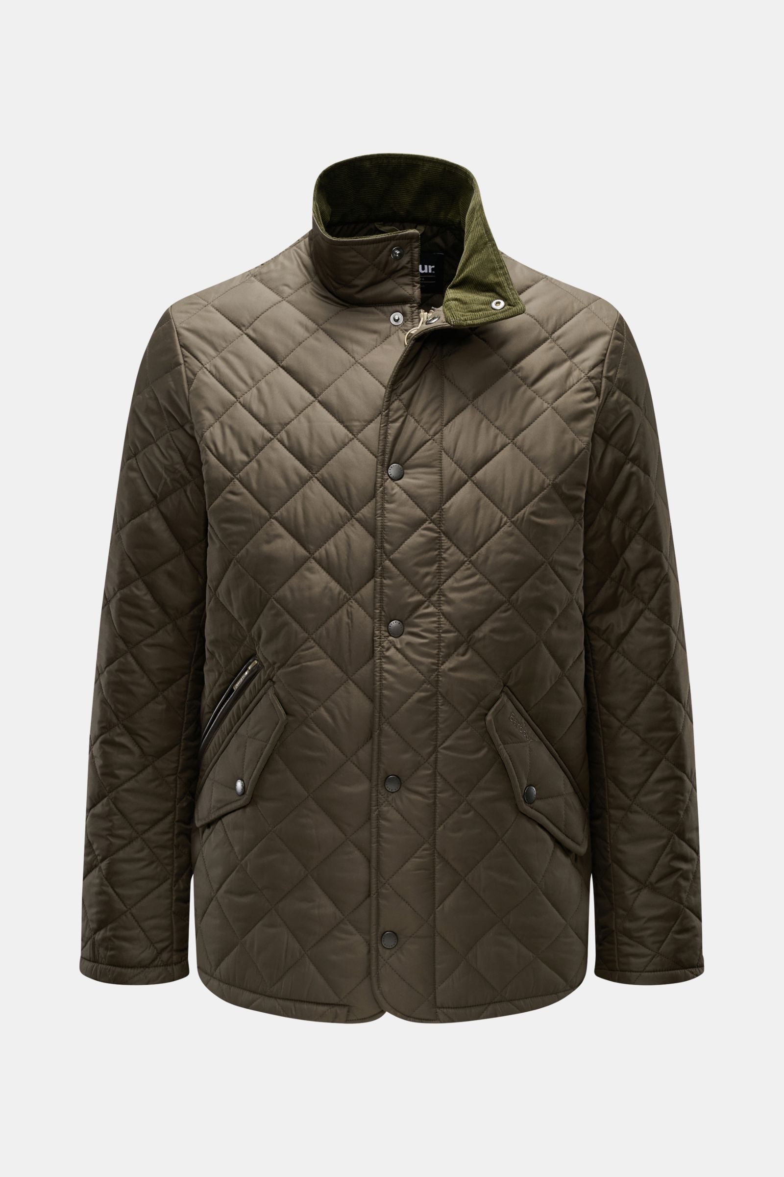 Front view of Barbour Quilted jacket 'Chelsea Sportsquilt' olive, unlined with lightweight padding, quilted microfibre, two-way zip, storm flap, corduroy collar, angled zipped and flap pockets, tonal stitching, and side adjusters.

Description: Perfect fo