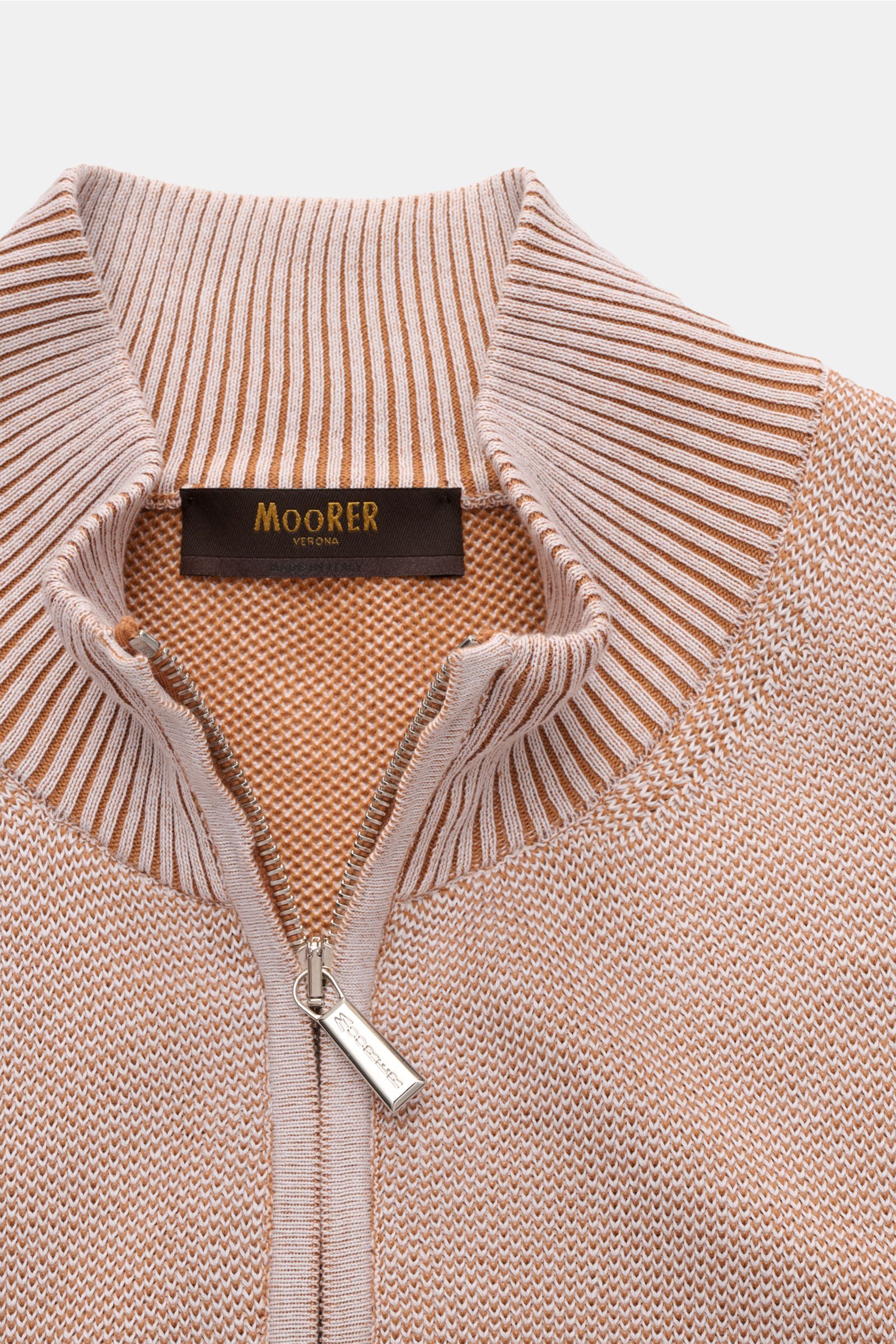 Moorer Cardigan 'Urbino' off-white/light brown mottled shown from above, highlighting ribbed standing collar, two-way zip, and knit texture. Confident layering: This MOORER cardigan has a clean silhouette and a timeless design that make it an essential