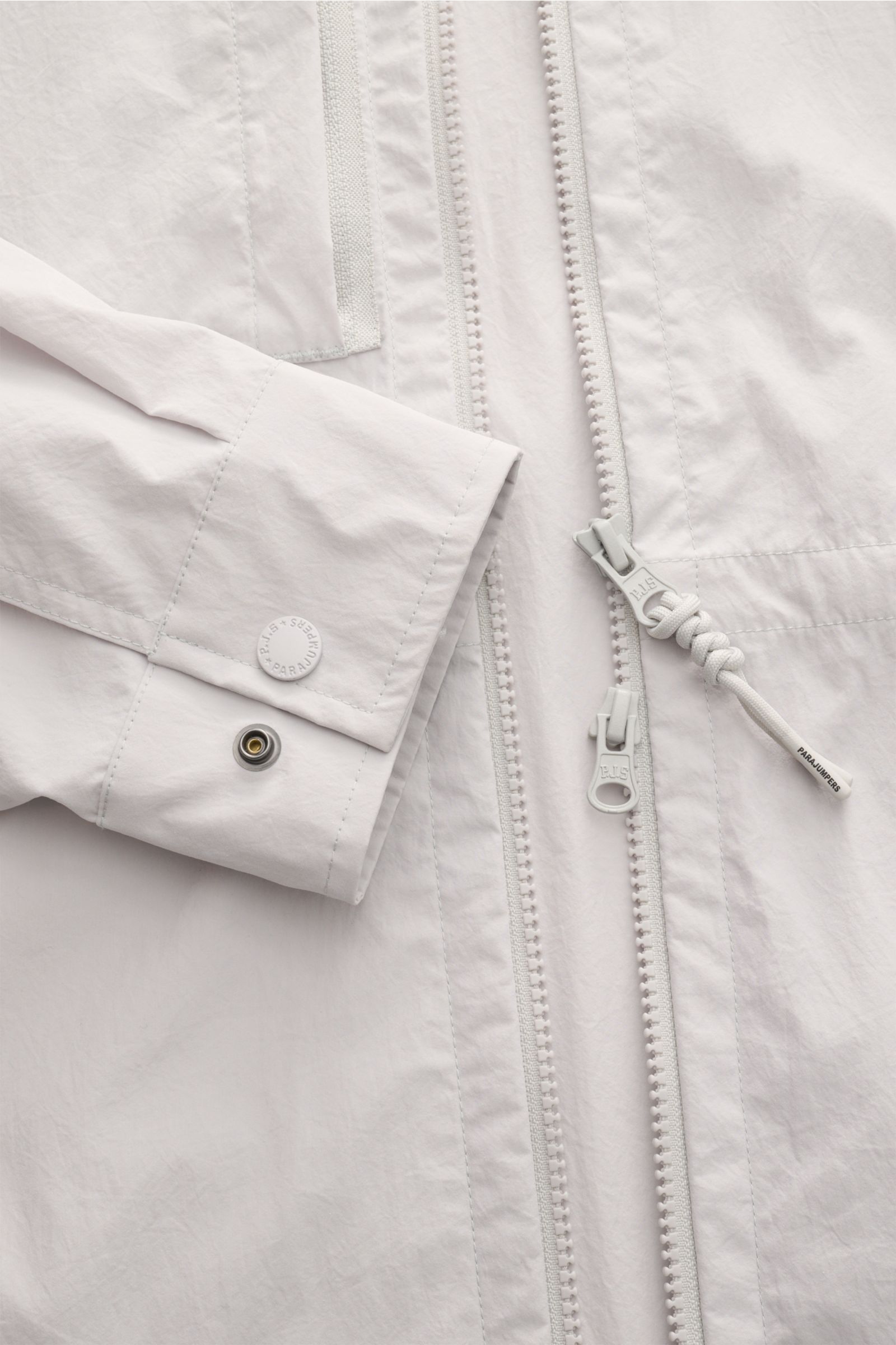 Close-up front view of Parajumpers Jacket 'Inverness' sand showing two-way zip, button cuff, and smooth crease-free microfibre fabric.