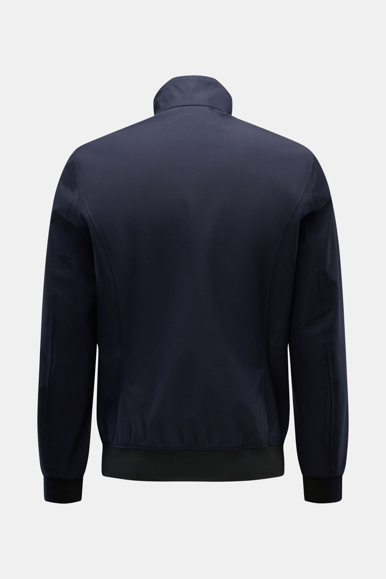 Rear view of UBR Blouson 'Bullet Savile' navy, showcasing minimalist, slim fit design with standing collar and flexible knit bands. Minimalist and functional: With its ultra lightweight design and the fine wool fabric, this 'Bullet Savile' blouson from UB