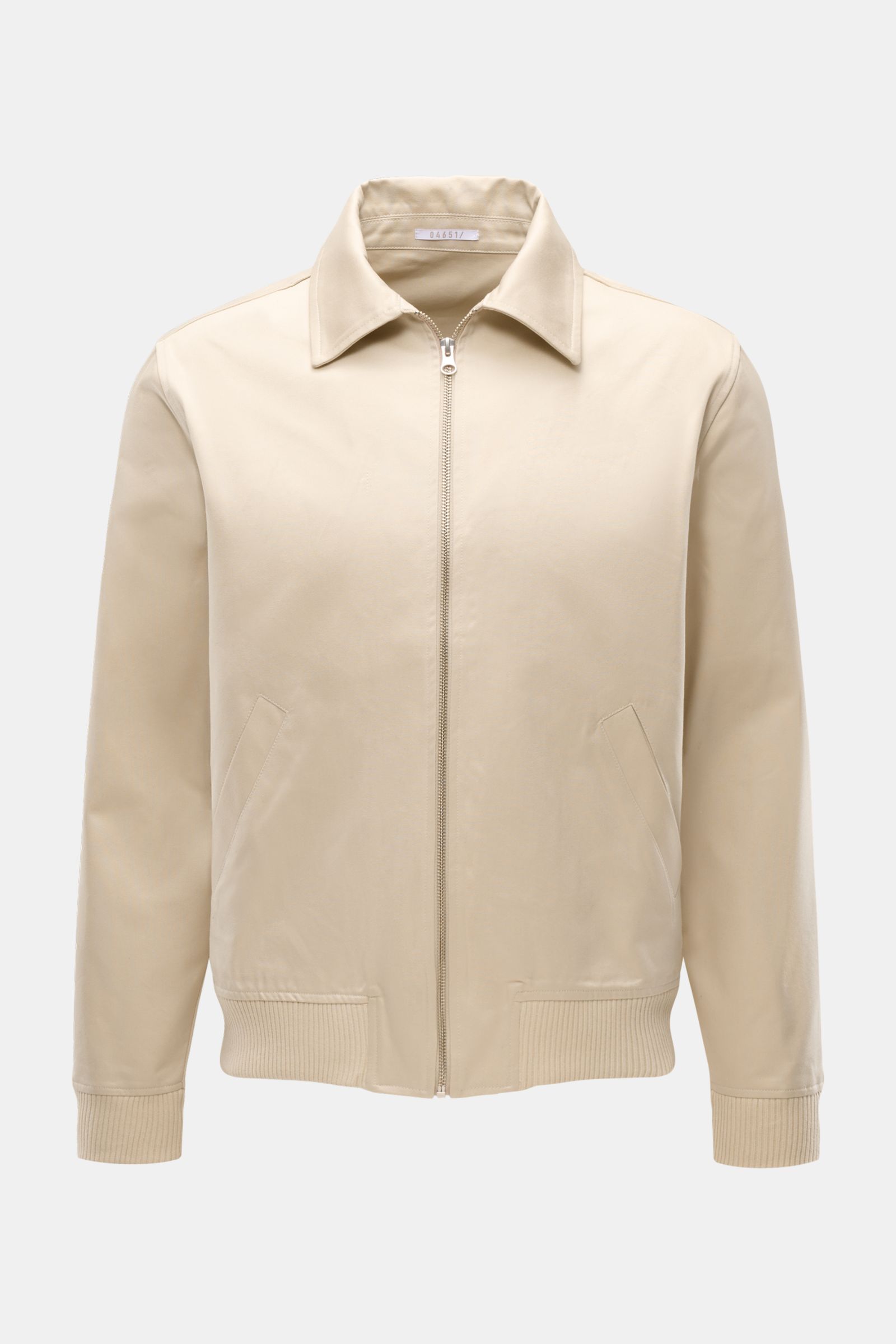 Front view of 04651/ A trip in a bag Blouson 'Griffin' beige, a slim fit cotton jacket with soft touch, zip closure, collar, elastic cuffs and hem, piped pockets, unconstructed design, and inner pocket, showcasing casual retro style.