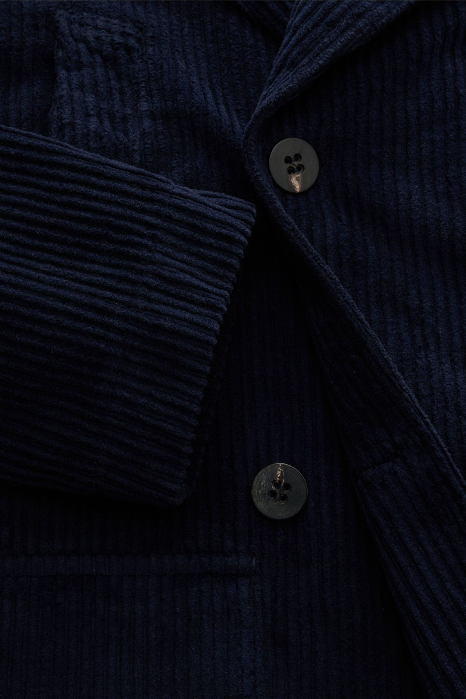 Close-up front view of 04651/ A trip in a bag Corduroy pea coat navy showing wide wale cotton corduroy fabric, double-breasted three-button placket, wide lapel collar, and front pocket flap. Make a statement this autumn with the pea coat 'Cord Peacoat' by