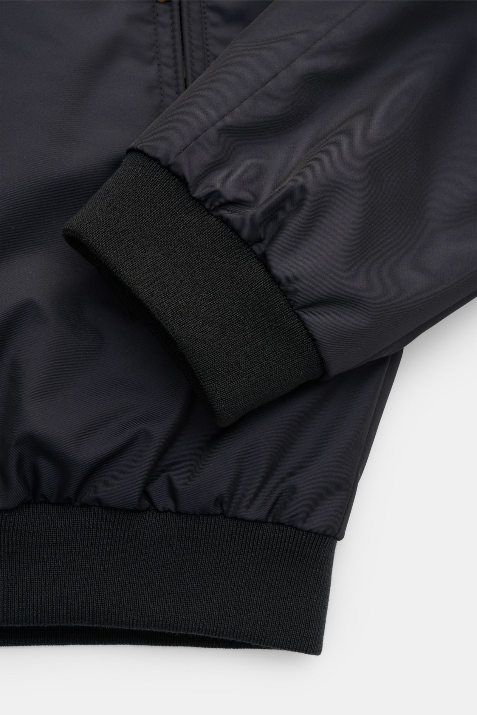 Close-up view of the elastic sleeve cuff and hem of the Moorer Blouson 'Corelli-Wk' dark navy, made from high-quality microfiber with a smooth feel, water-repellent finish, slim fit, typical blouson collar, zipper pockets including one on the upper arm, e