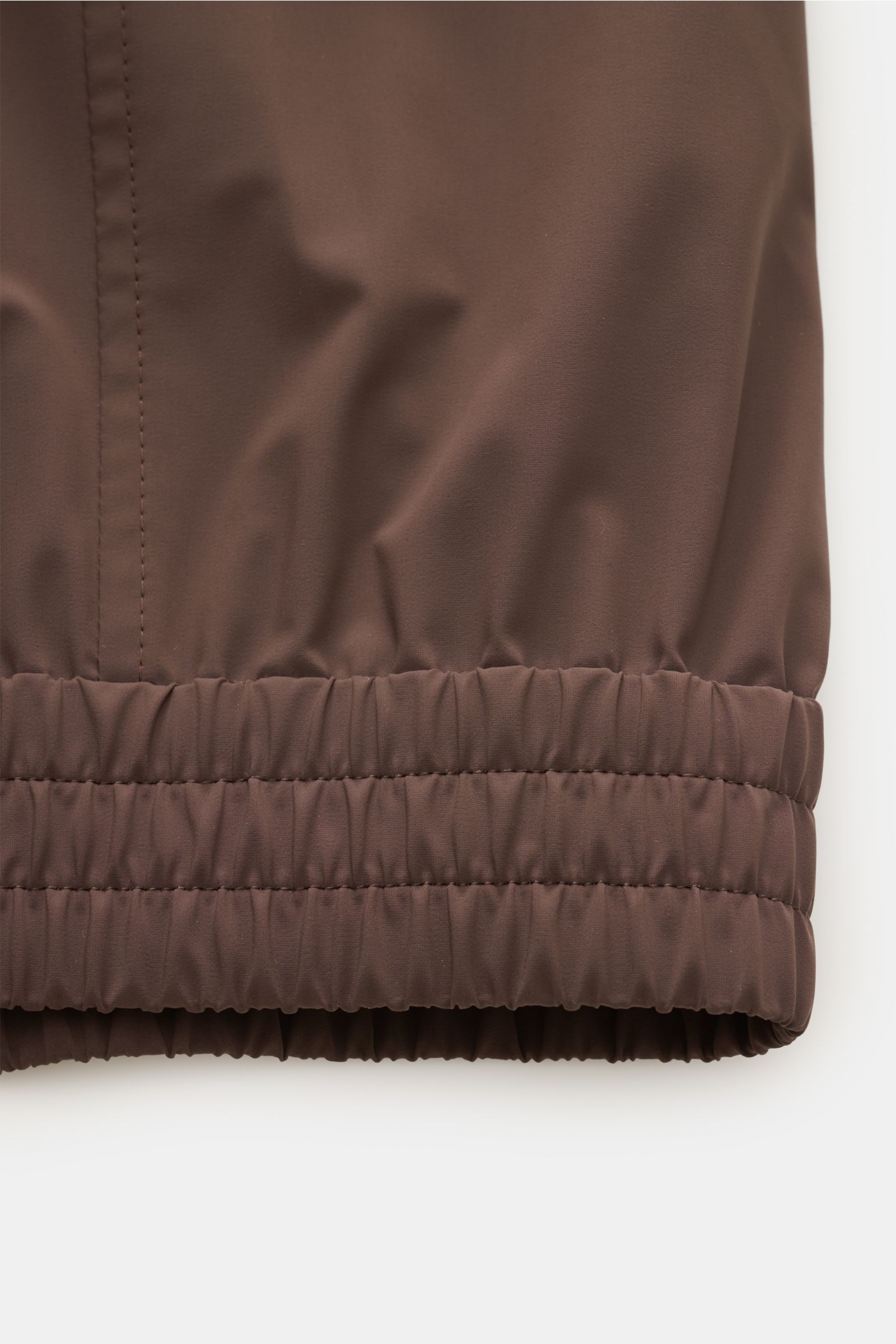 Close-up of the elastic cuff of the Brunello Cucinelli Blouson grau meliert, showing fabric texture and stitching from a side perspective.