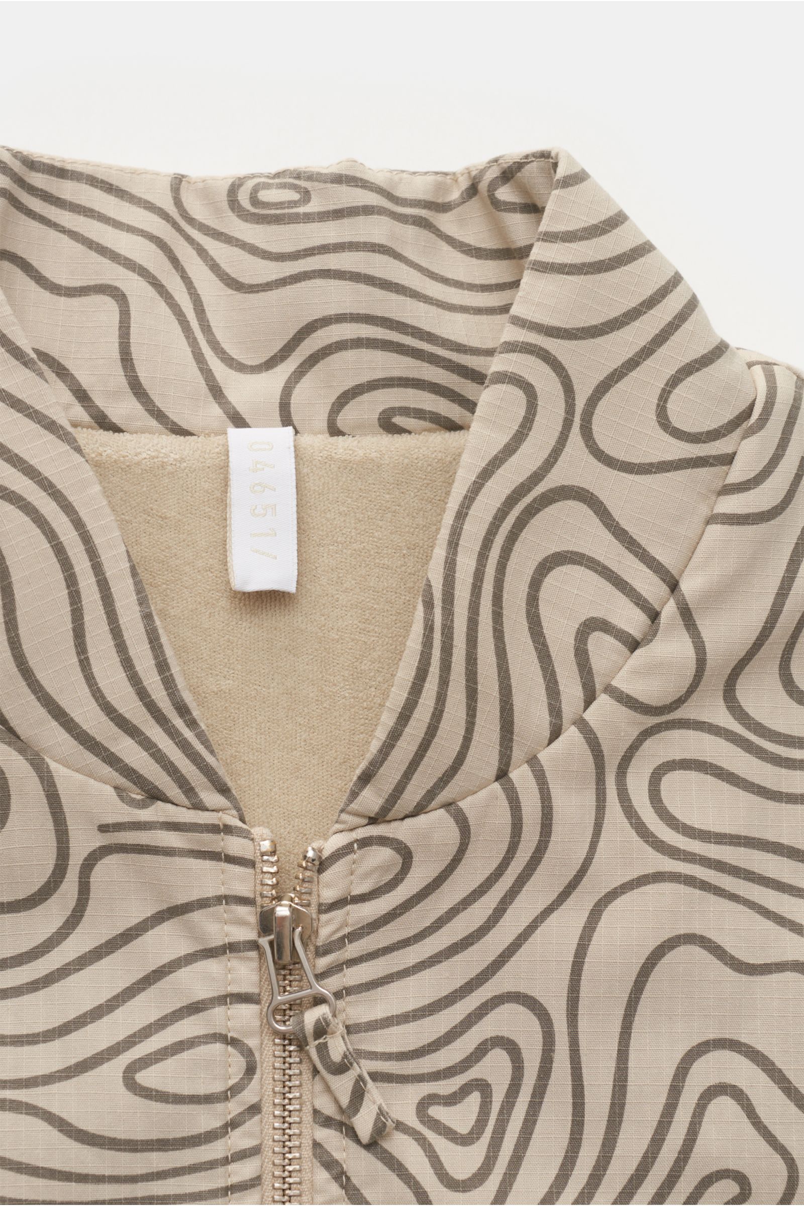 04651/ A trip in a bag Outdoor gilet 'Seamap' beige patterned