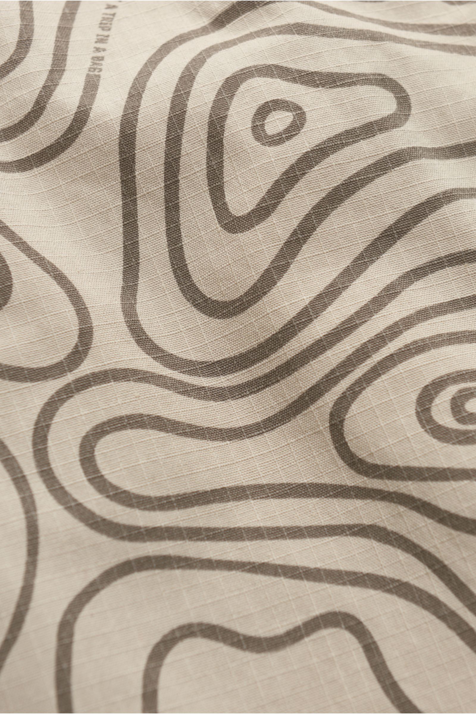 04651/ A trip in a bag Outdoor gilet 'Seamap' beige patterned