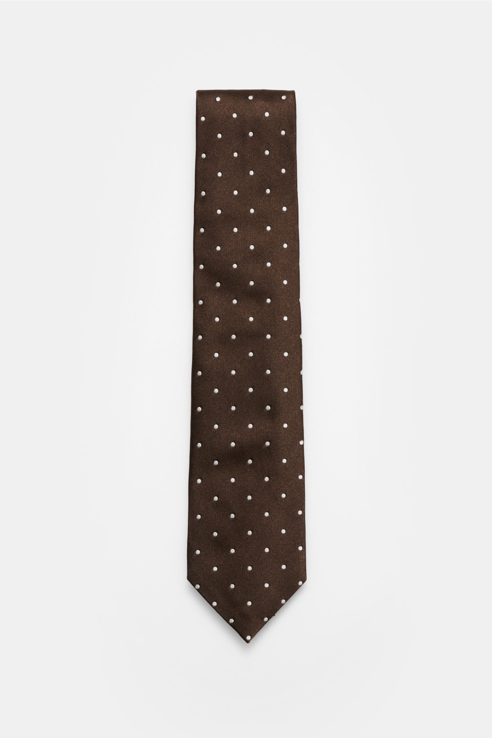 Top-down view of Tom Ford Seidenkrawatte dunkelbraun/creme gepunktet, a dark brown silk tie with cream polka dots.

Zeitloser Stil mit luxuriöser Note: Die Seidenkrawatte von TOM FORD überzeugt als elegantes Essential für formelle Anlässe und Office-Lo